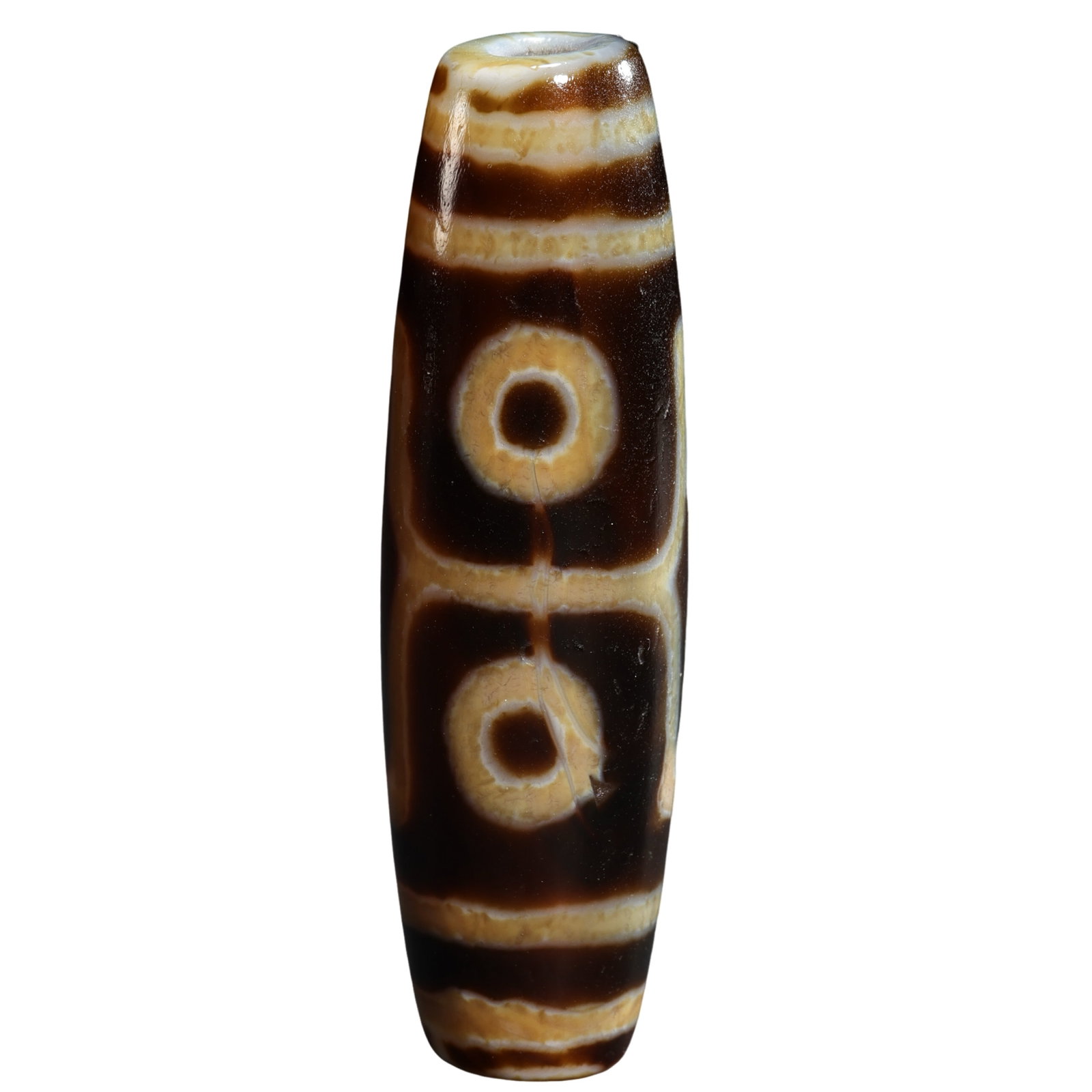 Ancient Tibetan Pure Two-Line Two-Eye Dzi Bead (Approximately 7th–10th Century): Size: Length 6 cm (2.36 in), Maximum Diameter 1.78 cm (0.70 in), Weight 29 g, approximately 0.20 ft; 7th–10th CenturyCondition & Provenance: The bead remains complete with no cracks or losses. The t