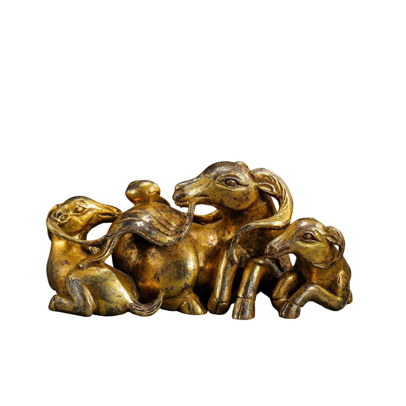 Gilt Bronze “Three Rams Bringing Prosperity?? Scholar’s Paperweight, Ming Dynasty (15th–17th: Size: Length 9.5 cm (3.74 in), Height 4.5 cm (1.77 in), Weight 483 g, Ming Dynasty 15th–17th CenturyCondition & Provenance: The piece is well preserved with a complete bronze body and no repairs. Th