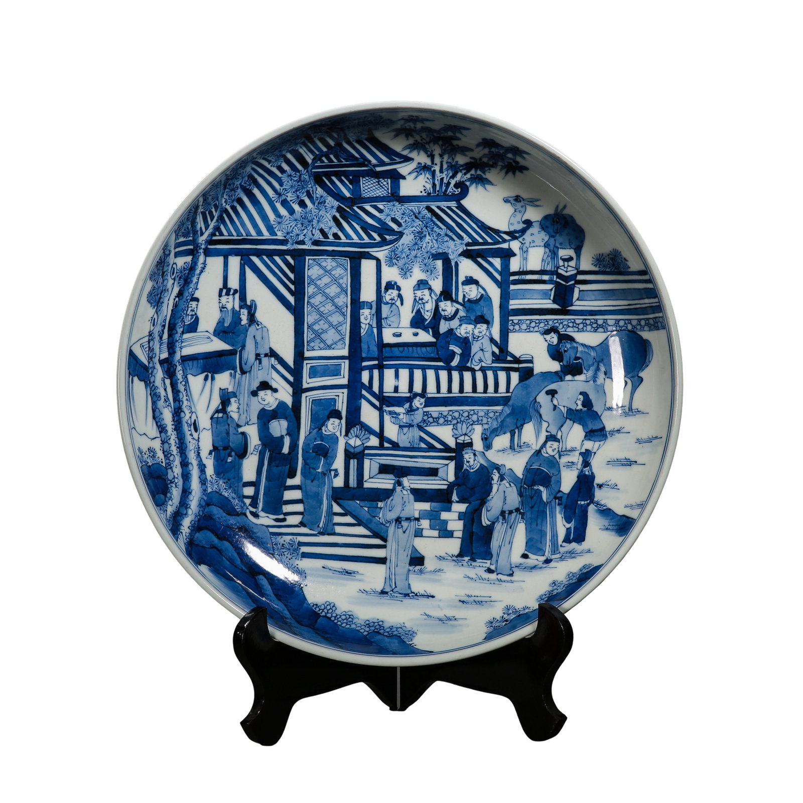 Qing Dynasty, Kangxi Period (1662–1722) Large Blue and White “Garden Gathering with Figures: Dimensions: Diameter 36.5cm / 14.37in, Height 7cm / 2.76in, Late 17th–Early 18th Century, Weight not specifiedCondition & Provenance: The charger is preserved in very good condition with stable porc