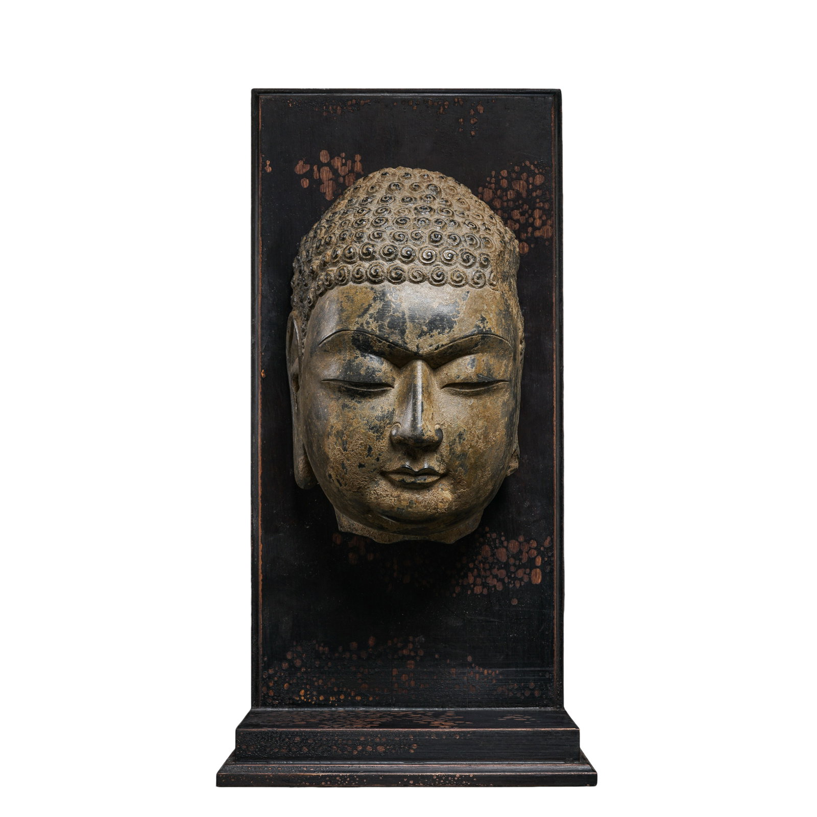 Stone?Carved Shakyamuni Buddha Head, Northern Dynasties 6th?7th Century: Measurements: Buddha head height 26cm(10.24in), Buddha head width 16cm(6.30in), overall height with original wooden stand 42cm(16.54in), Northern Dynasties 6th?7th CenturyCondition & Provenance: The s