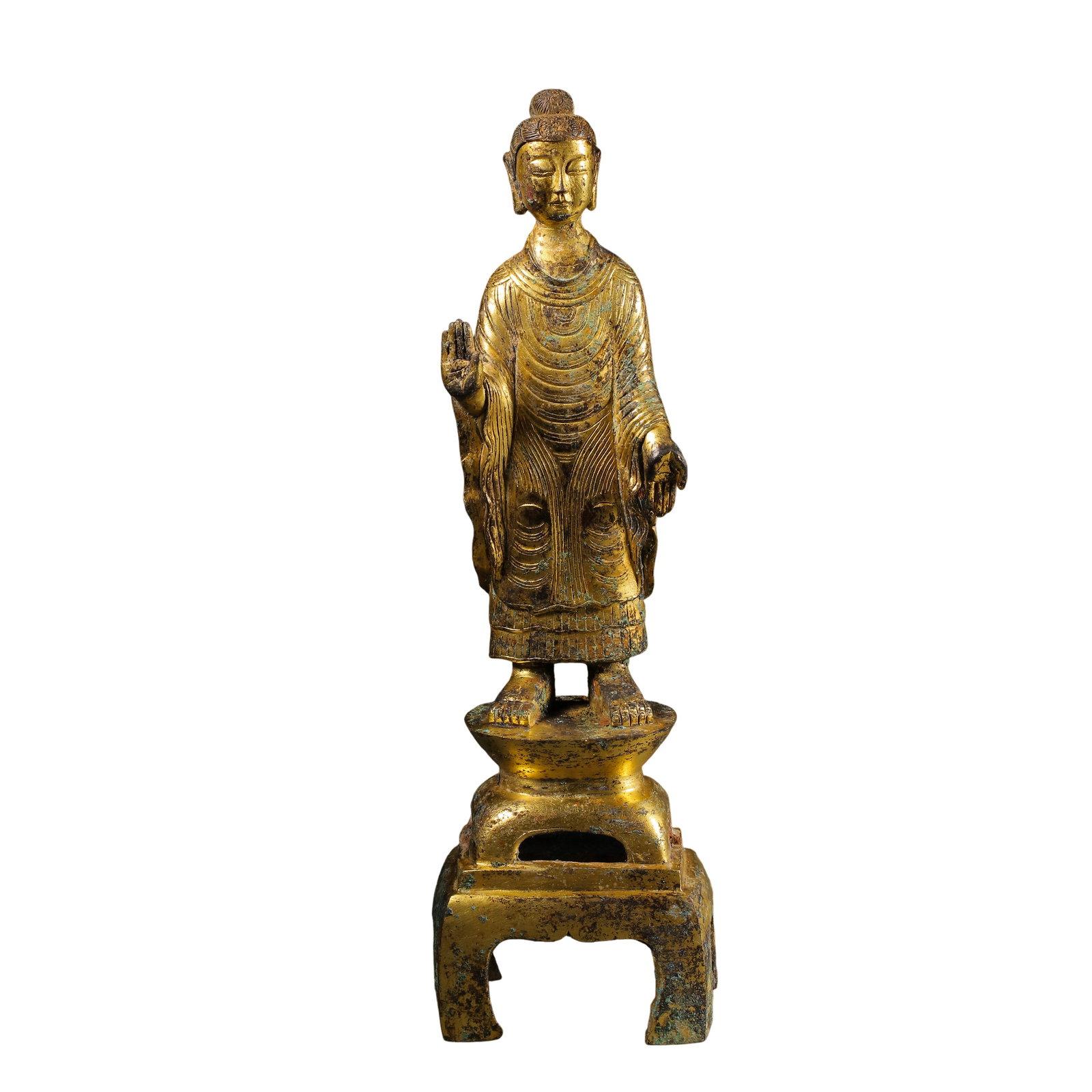 Northern?Southern Dynasties Gilt?Bronze Standing Shakyamuni Buddha Figure: Dimensions:Overall Height 21 cm (8.27 in),Width 6 cm (2.36 in),Weight 499g,5?6th Century?Condition & Provenance:The complete Buddha figure and its four?legged square base are original matching set wit