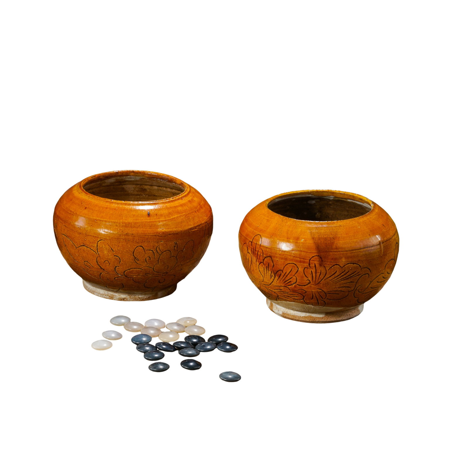 Complete Liao?Dynasty Go Set, Including Pottery Go?Board, Pair of Yellow?Glazed Carved Jars: Measurements: Square pottery go?board length and width 38.5cm(15.16in), overall height of board 8cm(3.15in); single yellow?glazed go jar height 9.5cm(3.74in), Liao Dynasty 907?1125 CECondition & Prove