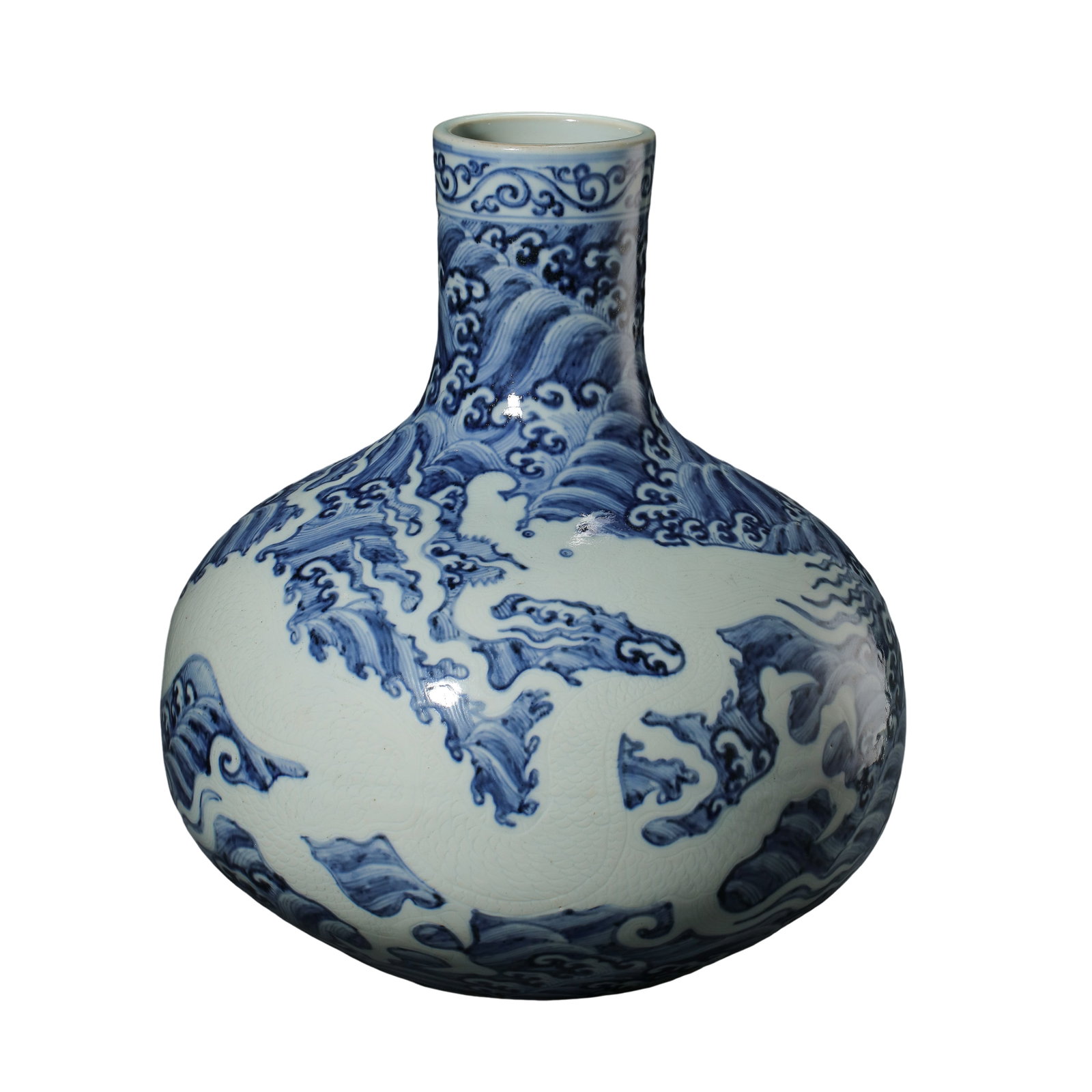Blue and White Globular Vase with Reserved Dragon Amid Ocean Waves, Yongle Period Ming Dynasty, 15th: Measurements: Overall height 44cm (17.32 inches), monumental 15th century Yongle imperial blue and white celestial globe vase with hidden white dragon wave motifCondition & Provenance: This monumental