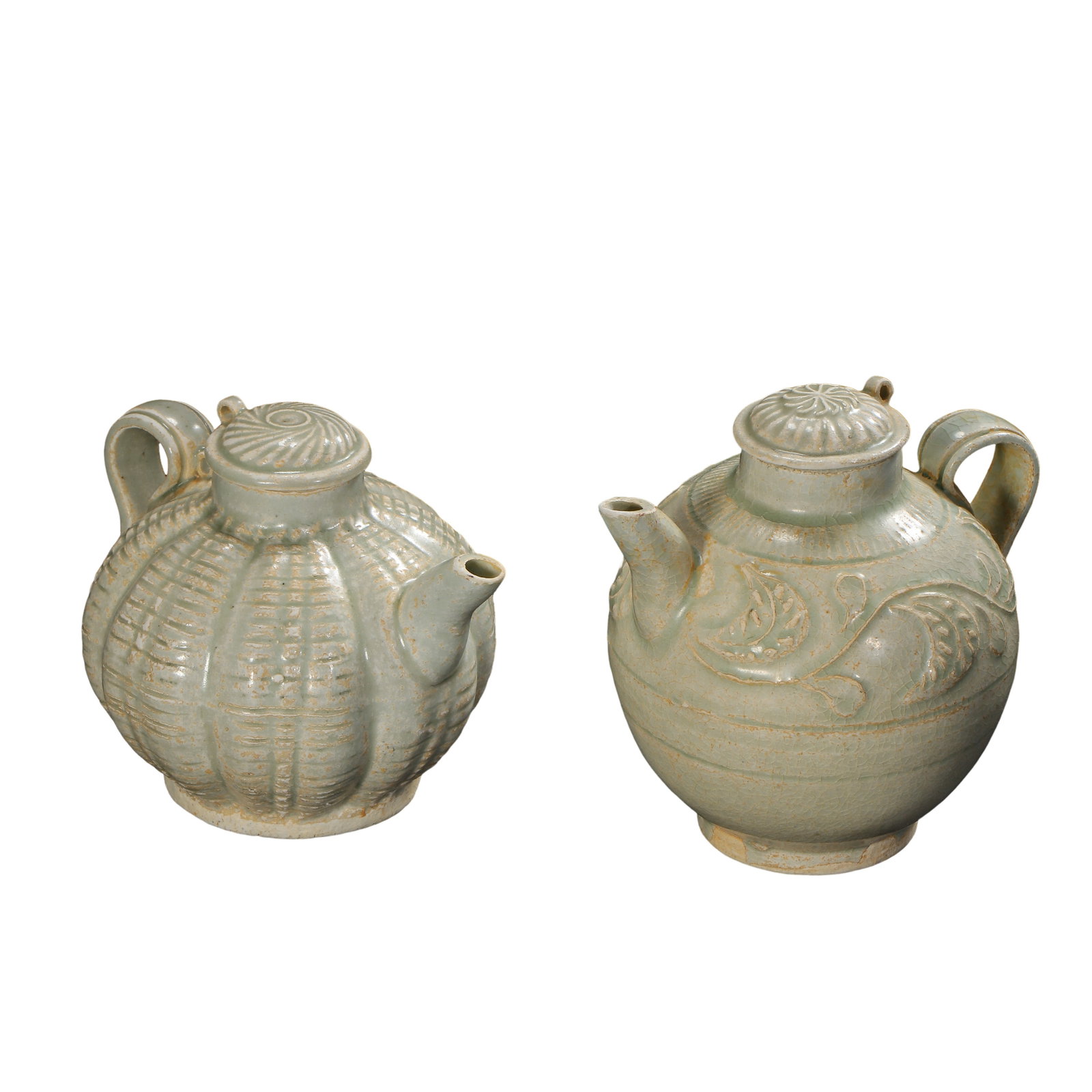 Pair of Song Qingbai Glazed Ewers, Melon?Ribbed and Carved Floral Pattern, Song Dynasty: Measurements: Melon?ribbed ewer: maximum belly diameter 11.5cm (4.53 inches), overall height 10cm (3.94 inches); Floral?pattern ewer: maximum belly diameter 11.3cm (4.45 inches), overall height 11.5cm