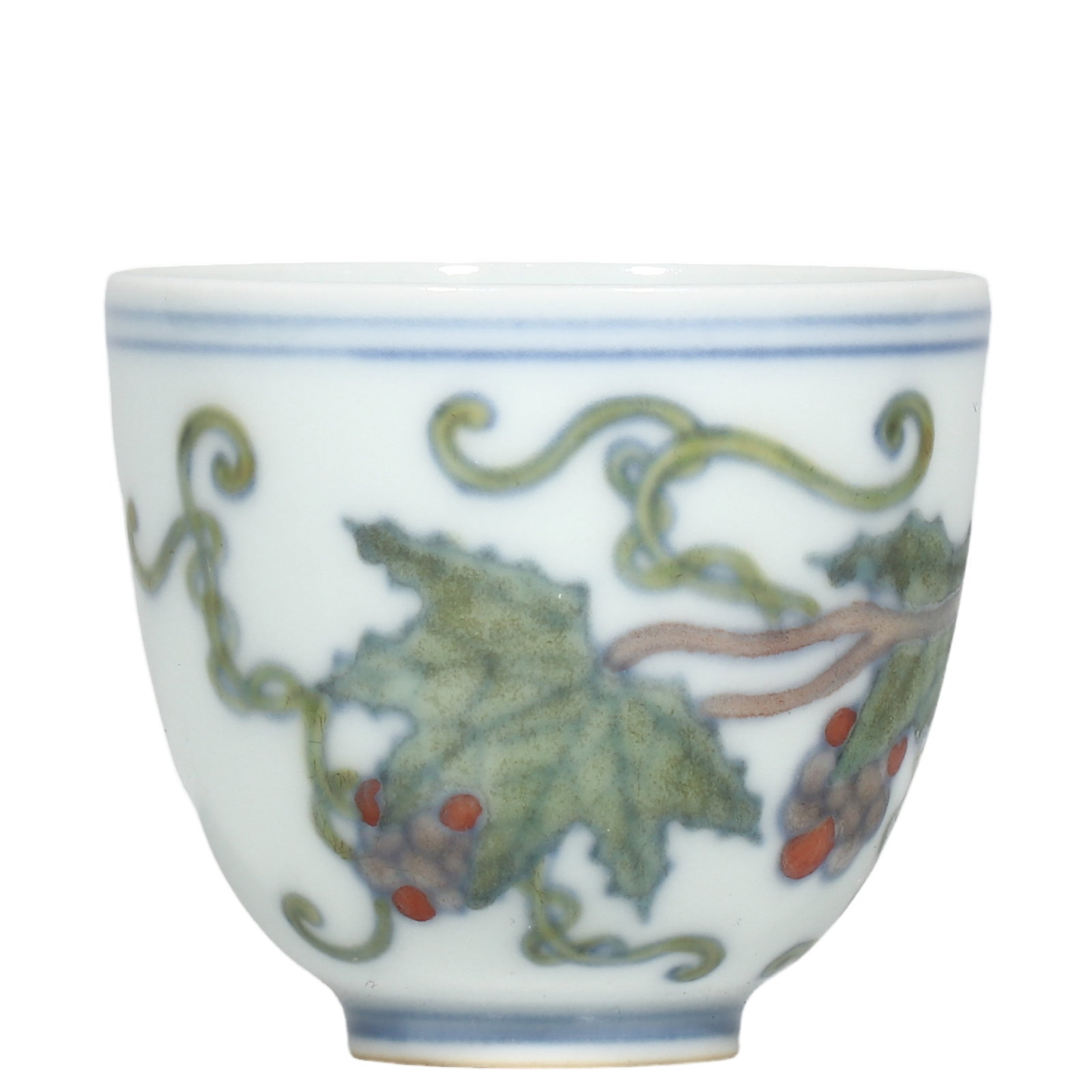 Ming Chenghua Period Doucai Cup With Grape?Vine Motif: Dimensions?H.5cm?Diam.5.6cm Condition & Provenance?Fully intact, no cracks or chips. Well?preserved enamels and glaze with natural aged patina. Old soil patina on unglazed foot?ring. No modern restora