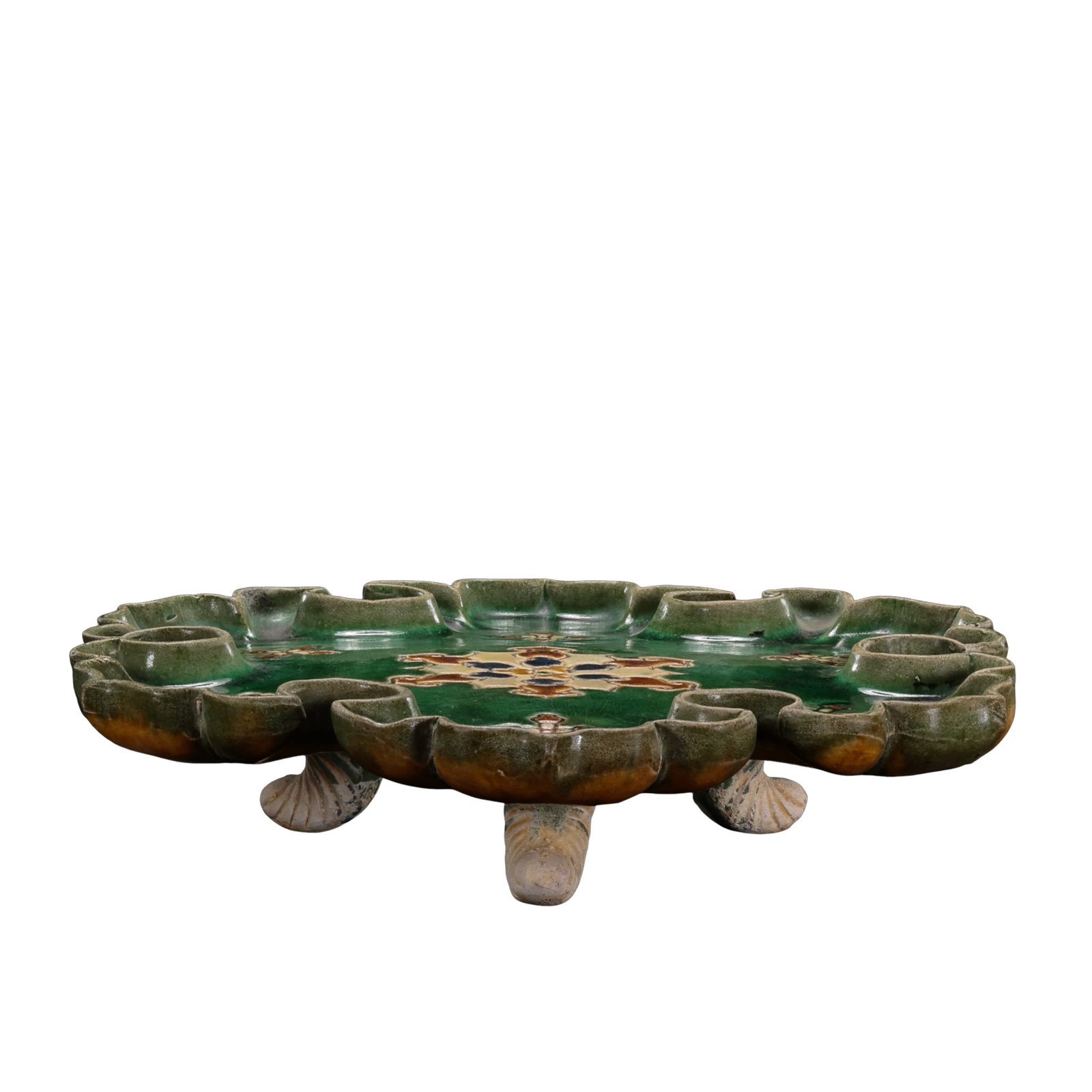 Tang Dynasty Sancai Green-Ground Openwork Floral Offering Tray with Three Feet & Treasure Flower: Measurements: Rim diameter 25.5cm (10.04 inches), overall height 5.2cm (2.05 inches), 7?10th century Tang low-fired lead-glazed potteryCondition & Provenance: The tray is fully intact with no cracks o