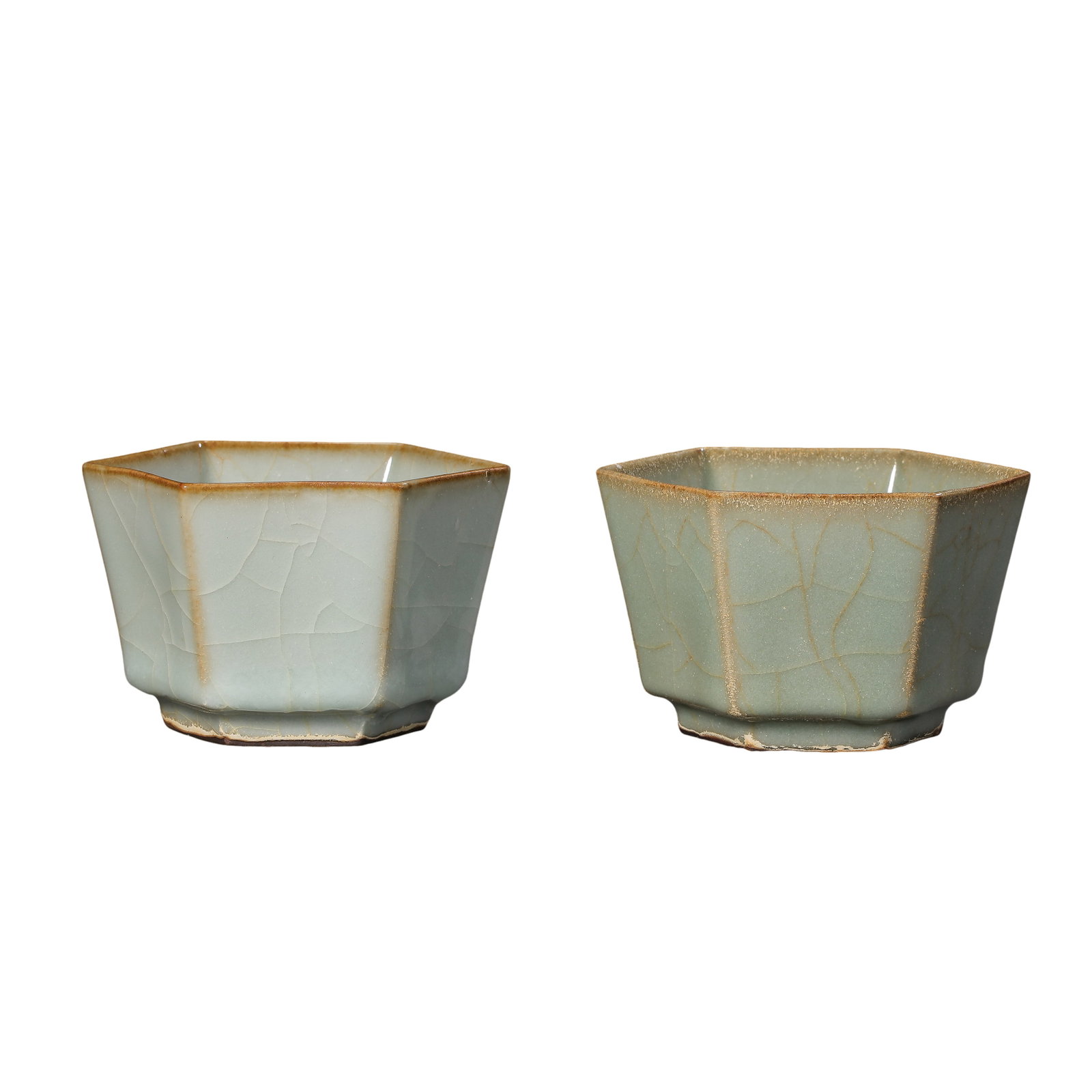Yuan Dynasty Longquan Kiln Celadon Hexagonal Cups, Pair (13th?14th Century A.D.): Dimensions?Mouth Diameter 8.5cm (3.35 in), Height 5.6cm (2.20 in), 13th?14th Century A.D.Condition & Provenance?Both cups are fully intact without cracks, chips or modern restoration. Soft powder?gree
