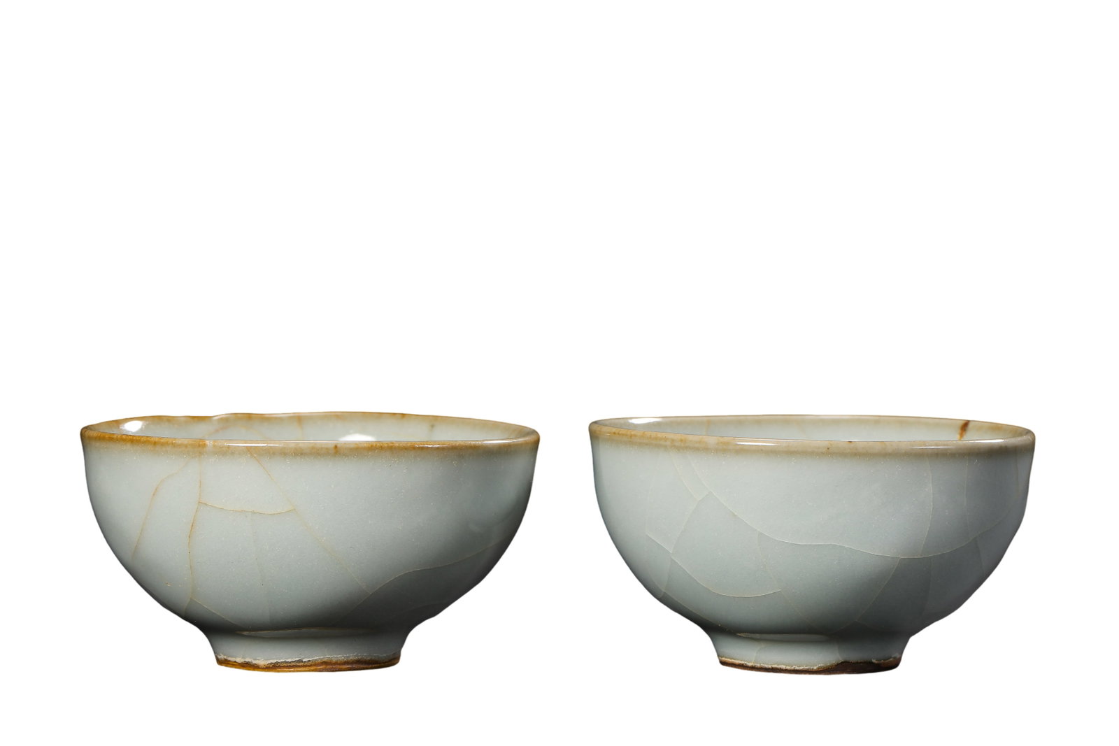 Pair of Southern Song Guan Kiln Moon?White Glazed Gold?Thread Crackle Floral?Rim Teacups: Dimensions?Each cup mouth diameter 7.6cm (2.99 in), height 4.1cm (1.61 in), 12th?13th Century A.D.Condition & Provenance?Both cups are fully intact, free of cracks, chips, glaze loss and modern restor