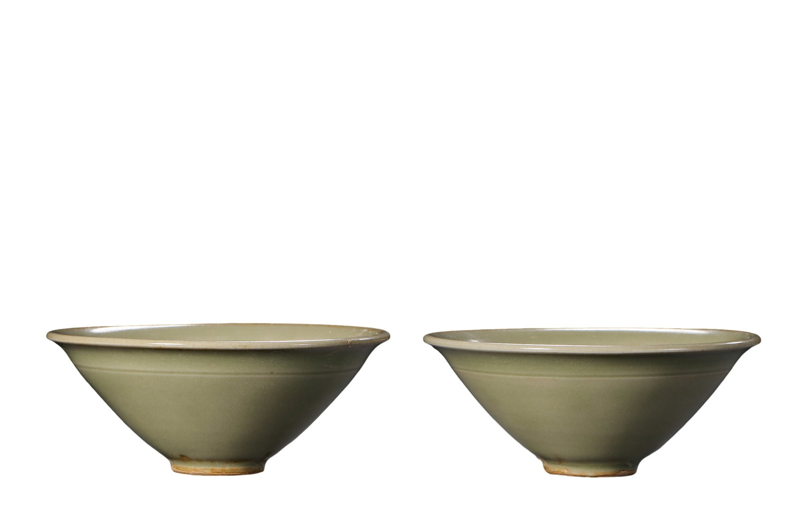 Pair of Song Dynasty Yaozhou Kiln Celadon Mould?Printed Floral and Swimming?Fish Conical Teacups: Dimensions?Each cup mouth diameter 9.8cm (3.86 in), height 4.2cm (1.65 in), 10th?13th Century A.D.Condition & Provenance?The matched pair is fully intact, without cracks, chips or modern restoration. 