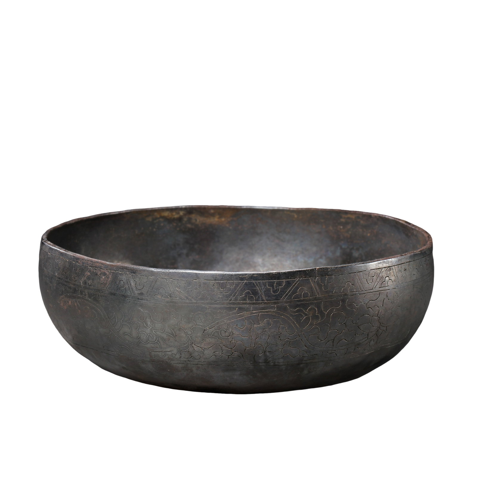 Tang Dynasty Silver Alms Bowl Chased with Interlocking Floral Scrolls,7thâ€“10th Century A.D.: Dimensions?Mouth diameter 15.2cm (5.98 in), height 6cm (2.36 in), weight 284.2g, 7th–10th Century A.D.Condition & Provenance?The silver vessel is structurally intact without cracks or major losses, 