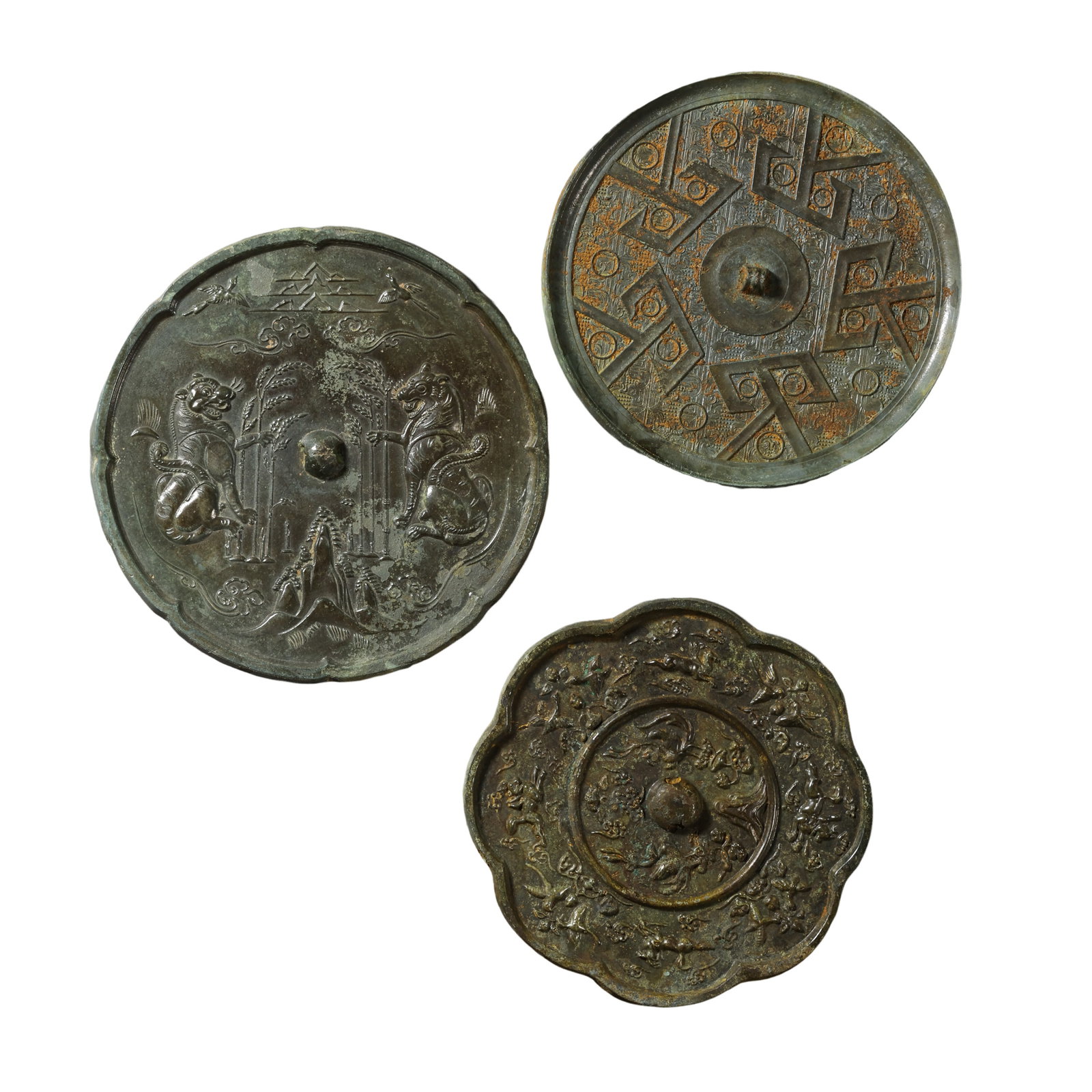 A Group of Three Tang Dynasty Bronze Mirrors with Auspicious Beast, Floral and Geometric Designs (1 of 12)