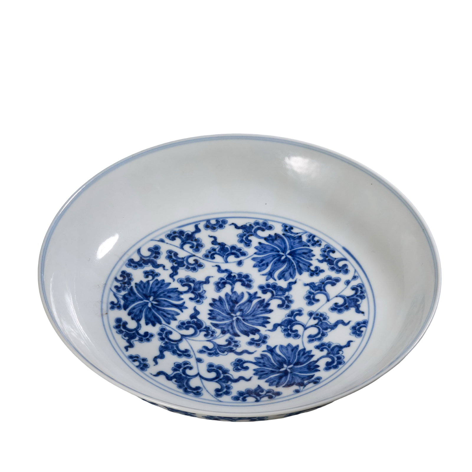 Daoguang Period Qing Dynasty Blue and White Interlocking Floral Treasure?Bloom Porcelain Plate: Dimensions:Diameter 20.3cm(7.99in),Height 4.5cm(1.77in),19th CenturyCondition & Provenance:The plate remains intact with rich,well?balanced cobalt blue pigment and glossy glaze surface.Only faint age?