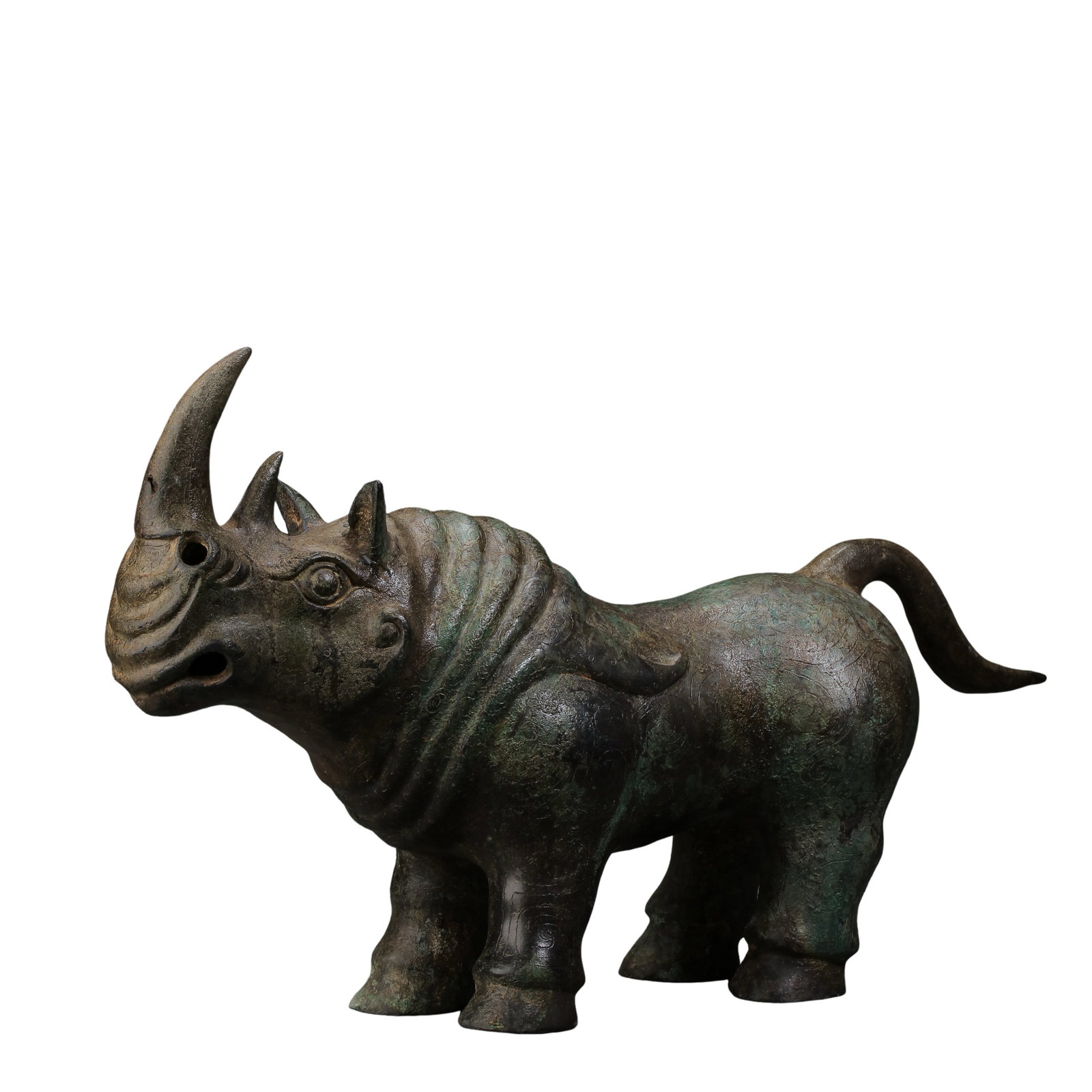 Western?Zhou Dynasty Bronze Rhinoceros Vessel(Zun),11th?8th Century BCE,: Dimensions:Length 35.5cm,height 16.5cm,weight 2600gCondition & Provenance:Fully cast in one piece,the vessel is complete.Rhinoceros horns,four legs and tail are well preserved.The surface bears thick 