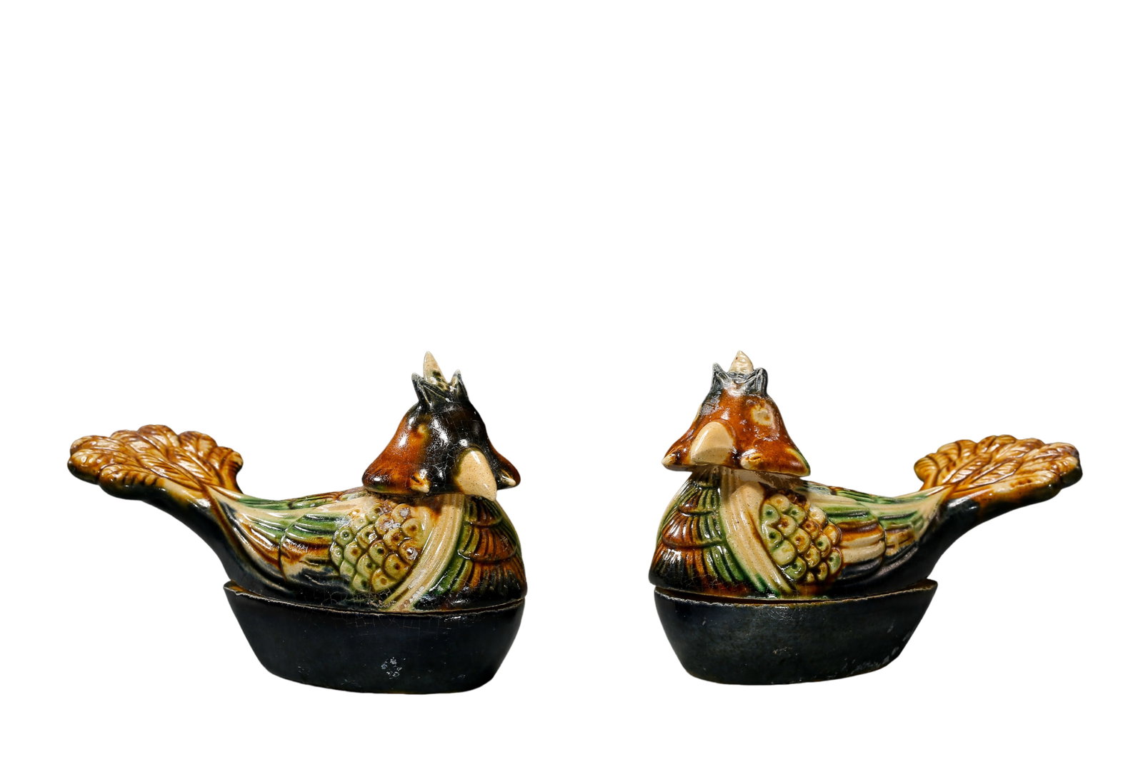 Tang Dynasty Sancai?Glazed Mandarin Duck Covered Boxes?Pair,7th?10th century Chinese: Dimensions:Single piece Length 12cm(4.72in),Height 7.2cm(2.83in),7?10th century Tang sancai potteryCondition & Provenance:The pair survives complete with original lids matching each base. Mandarin?duc
