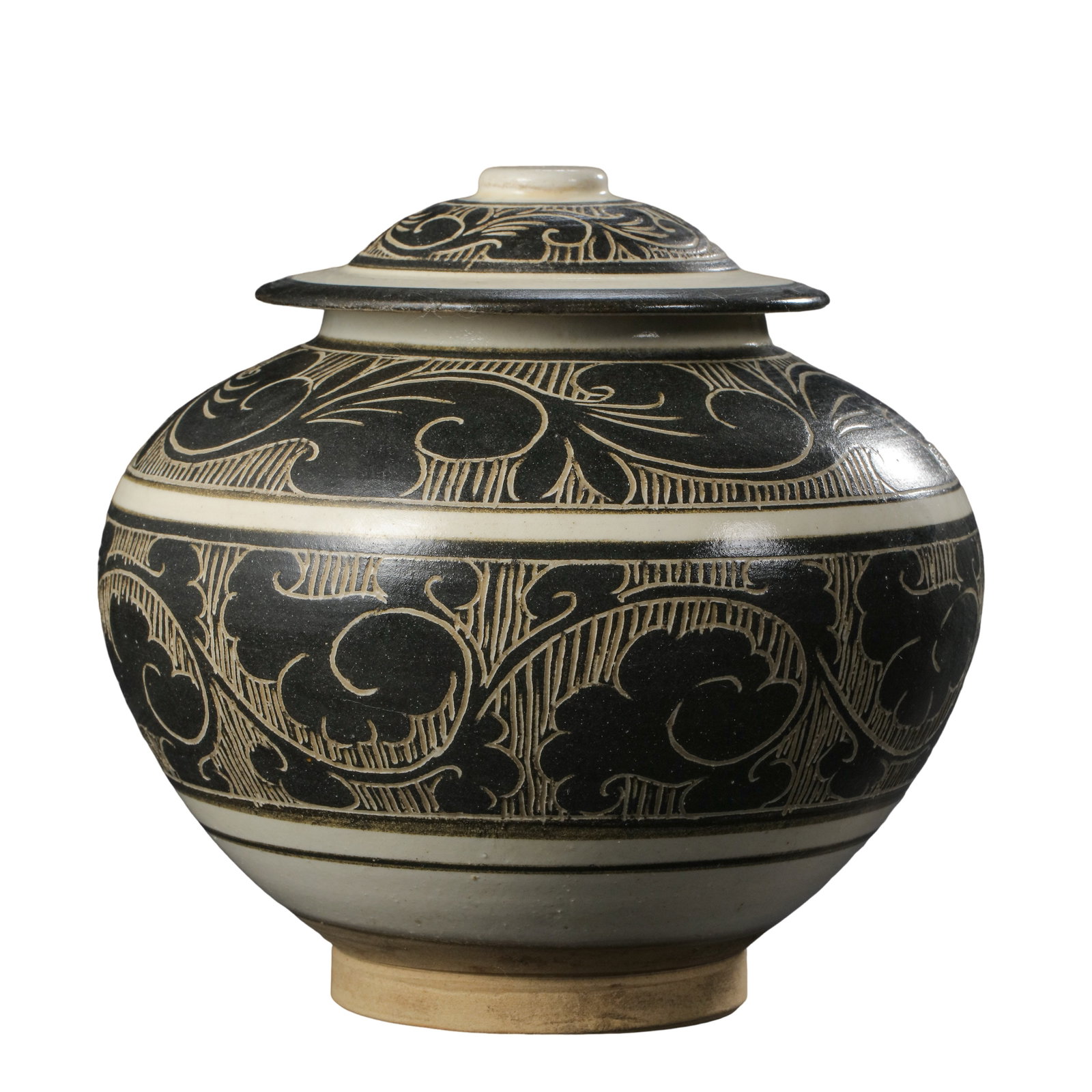 Song Dynasty Cizhou Kiln White Ground Black Carved Interlocking Floral Covered Jar: Dimensions?Maximum Width 18 cm (7.1 in), Overall Height 16.2 cm (6.4 in), 10th–13th Century CECondition & Provenance?The jar and its original matching lid form a complete set, free of cracks, chips,