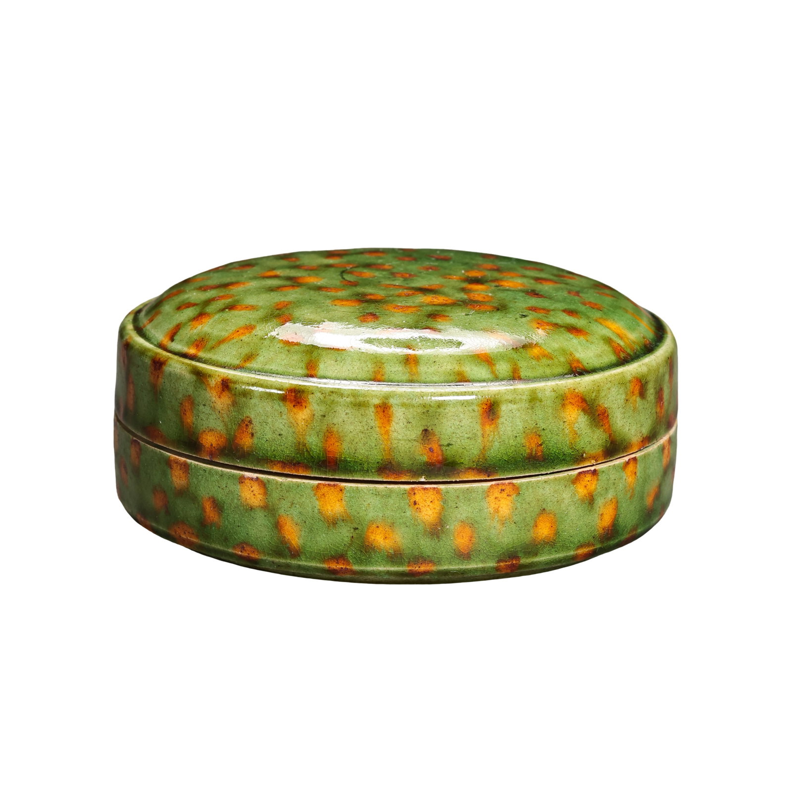 Tang Dynasty Sancai Green Ground Splashed Brown Round Cosmetic Box,Tang Dynasty (7th-10th Century): Dimensions: Overall Height 2.8cm (1.10in), Mouth Diameter 6.5cm (2.56in), Tang Dynasty, 7th to 10th CenturyCondition & Provenance: The lid and base of this cosmetic box are original matching set, full