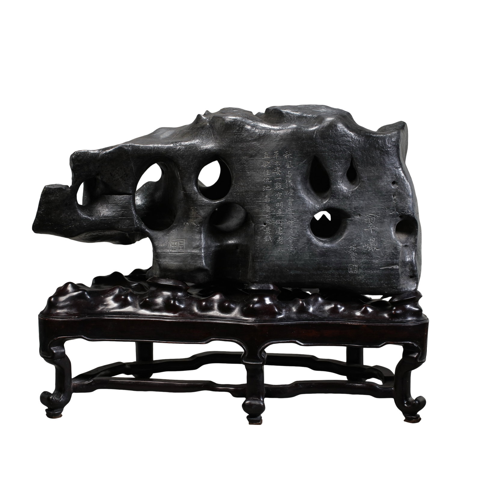 Black Taihu Scholar’s Rock Entitled “Cui Yan?? with Poem Inscription and Original Hardwood: Dimensions:Rock width 56 cm (22.05 in),rock height 30 cm (11.81 in),overall height with original stand 45 cm (17.72 in),Qing Dynasty,18th?19th CenturyCondition & Provenance:This Taihu stone is natural