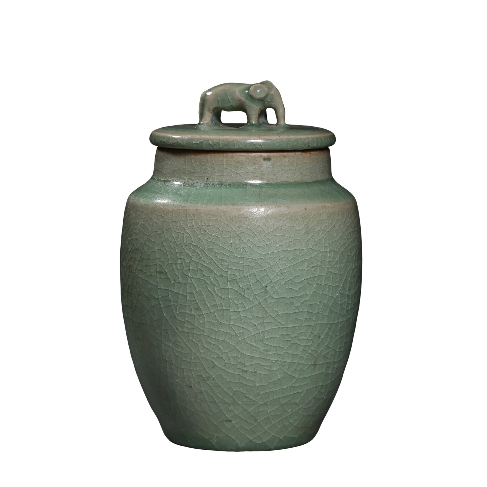 Ming?Dynasty Longquan Celadon Covered Jar with Elephant?Form Finial: Dimensions?Height 14?cm (5?1/2?in), Mouth Diameter 9.3?cm (3?21/32?in); Ming DynastyCondition & Provenance?Jar and original cover are complete. Minor glaze frits and age?related surface wear can be se