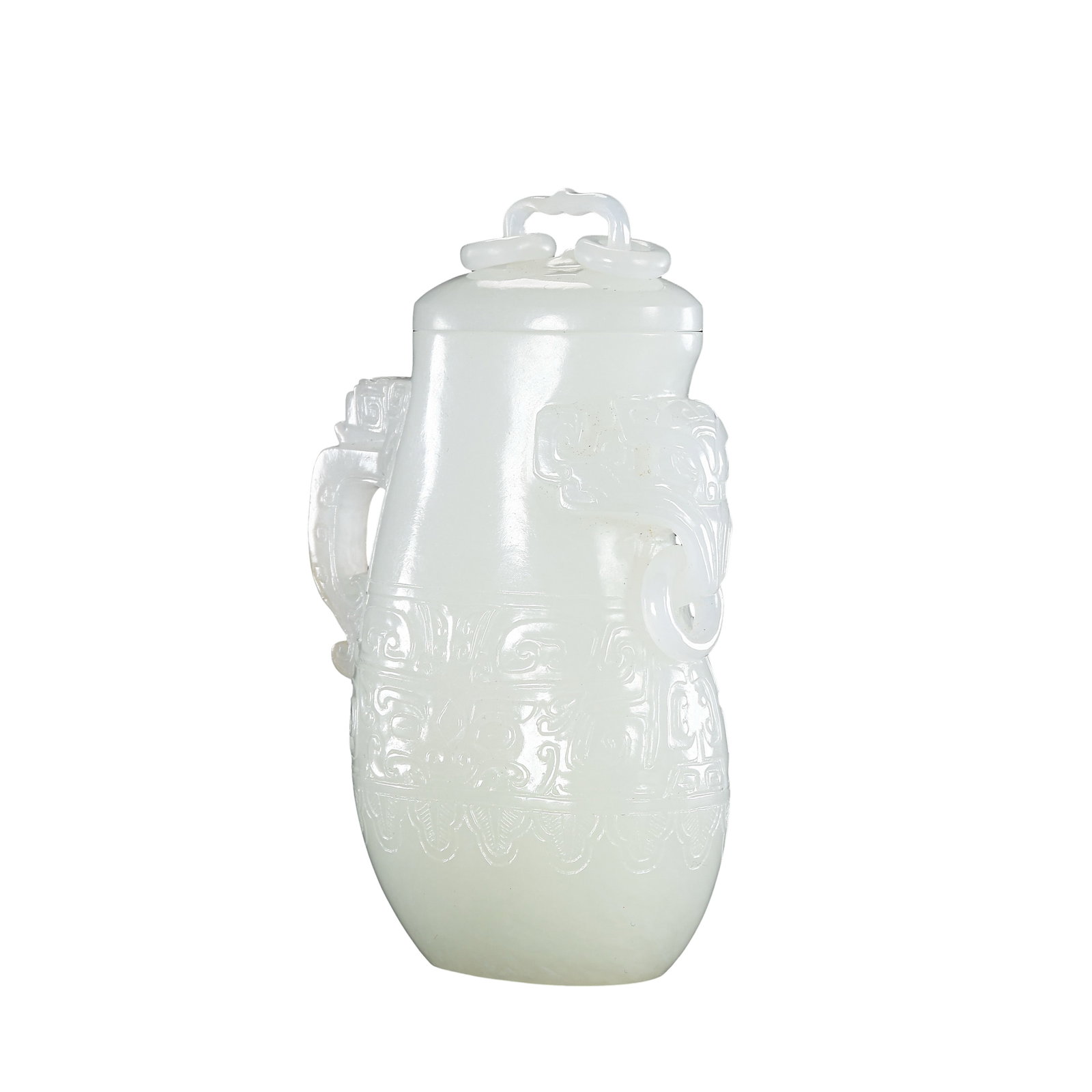 White Hetian Jade Archaistic Covered Vase with Dragon?Head Handles, Qing Dynasty: Dimensions:Height 10cm (3?15/16in), Width 6.5cm (2?9/16in), Weight 220gCondition & Provenance:The vessel is fully intact, lid, loose rings and body are all well?preserved without cracks, chips or rest