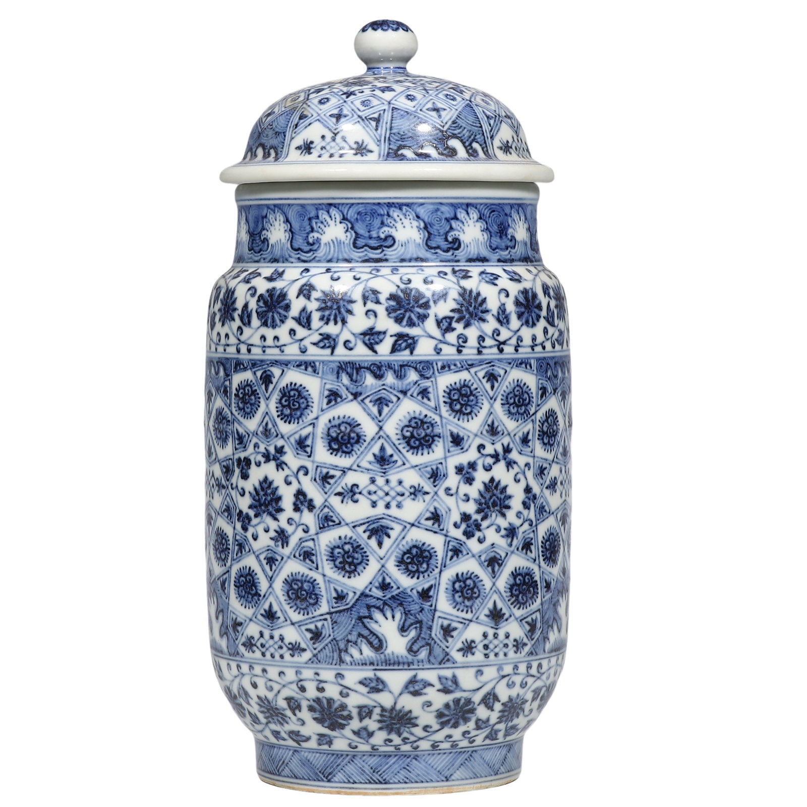 Ming Jiajing Blue?and?White Cylindrical Jar with Lid and Brocade?Ground Floral Motifs,Ming: Dimensions?H.0.951 ft.?H.29 cm.? Condition & Provenance?This lidded jar is completely preserved with its original cover,free of cracks and hidden hairlines,the rim,cover edge and foot rim only show mi