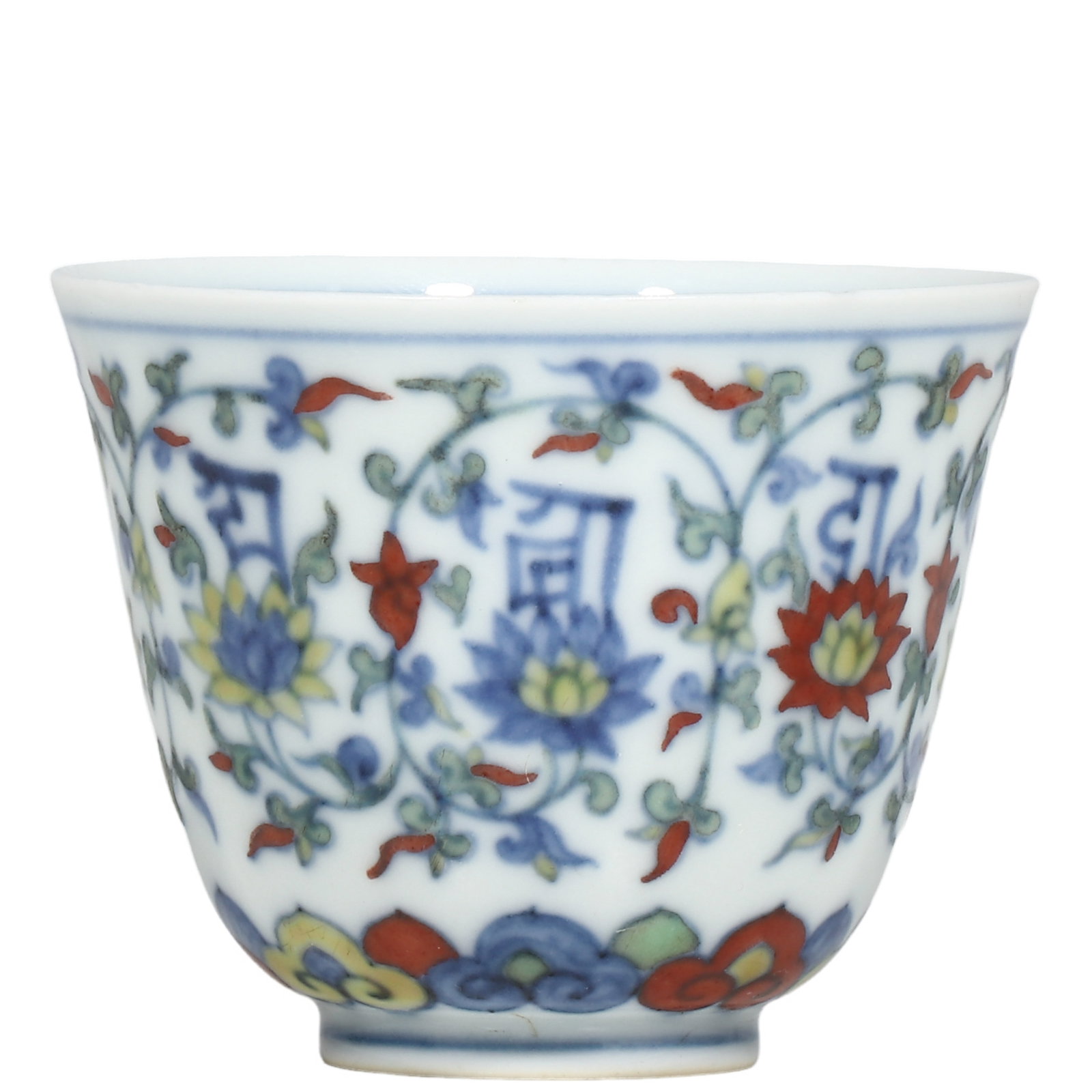 Ming Chenghua Period Doucai Cup With Interlocking Lotus and Sanskrit Inscriptions: Dimensions?H.6.5cm?Diam.7cm Condition & Provenance?Fully intact, no cracks or chips. Glaze and enamels well?preserved with natural aged patina. Old soil patina on unglazed foot?ring. No modern restora