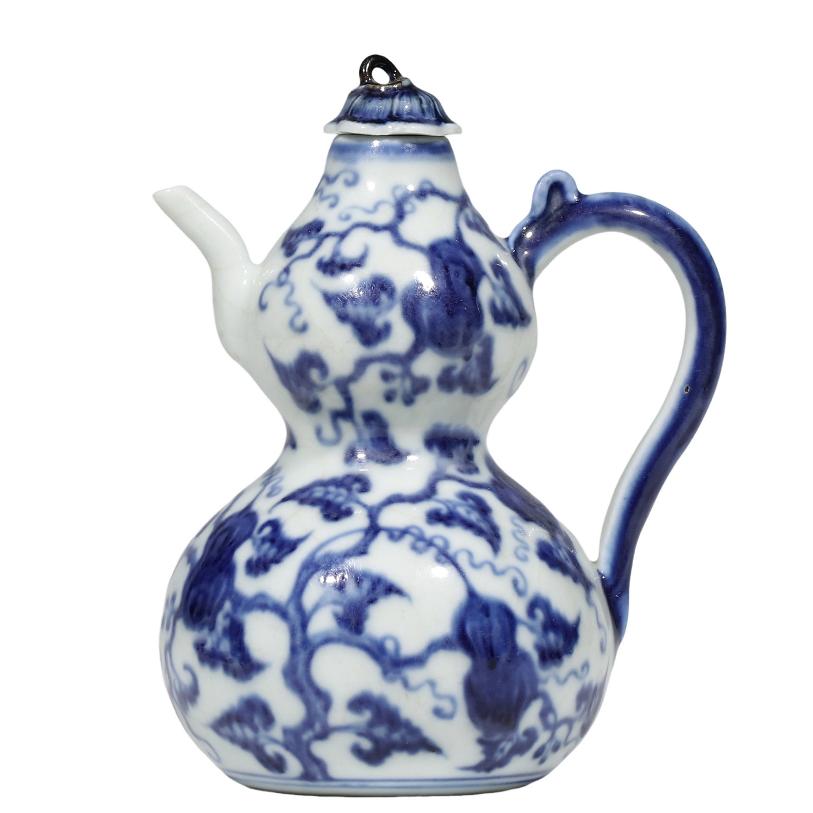 Yongle Period,Ming Dynasty,15th Century,A Blue?and?White Gourd?Shaped Ewer with Intertwined: Dimensions?Height 14.5cm(5.71 in),Mouth Diameter 2.8cm(1.10 in),Base Diameter 6.6cm(2.60 in),15th Century Condition & Provenance?Original matching lid intact, ewer body complete. Glaze bears natural a