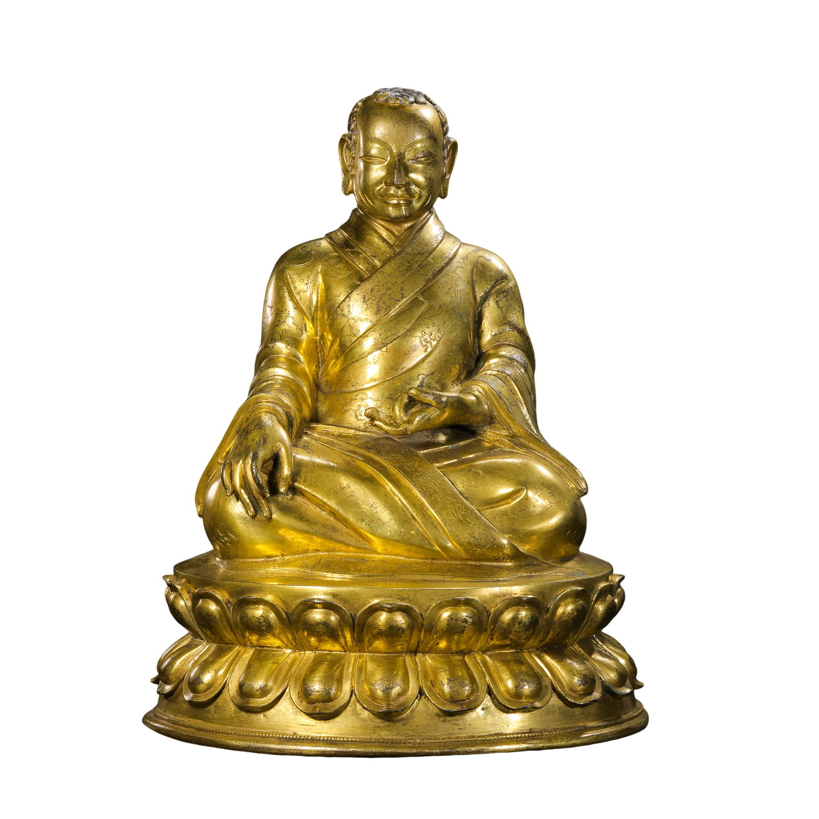 18th Century,Tibetan Gilt?Bronze Seated Lama Master: Dimension?H 31cm,W 23.3cm,Weight 6.06kg Condition & Provenance?The figure is cast as a single unit.Most original gilding survives well.Age?related wear and partial gilding loss are visible from centur
