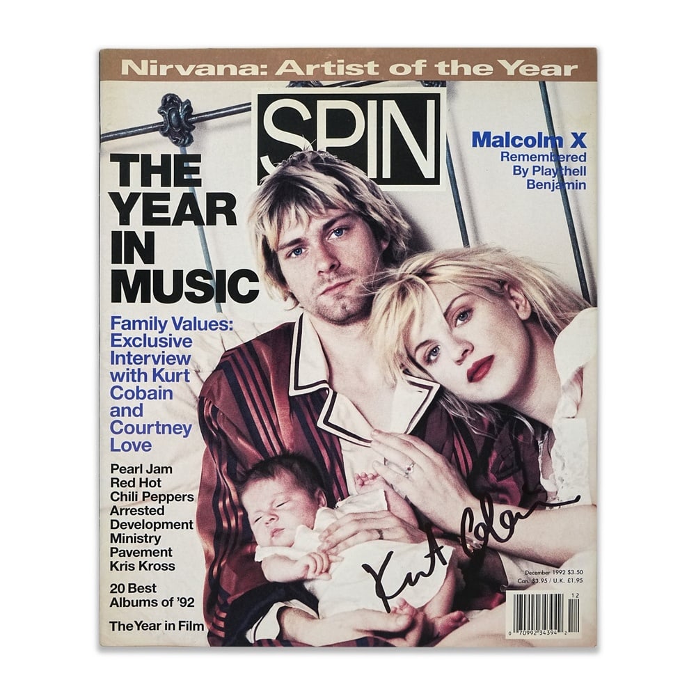 KURT COBAIN SIGNED "SPIN" MAGAZINE - YEAR IN MUSIC 1992: 12 x 10 in (30.5 x 25.5 cm) Provenance and Authentication: According to the accompanying documentation provided by the consignor, the signatures have been examined with reference to multiple factors,