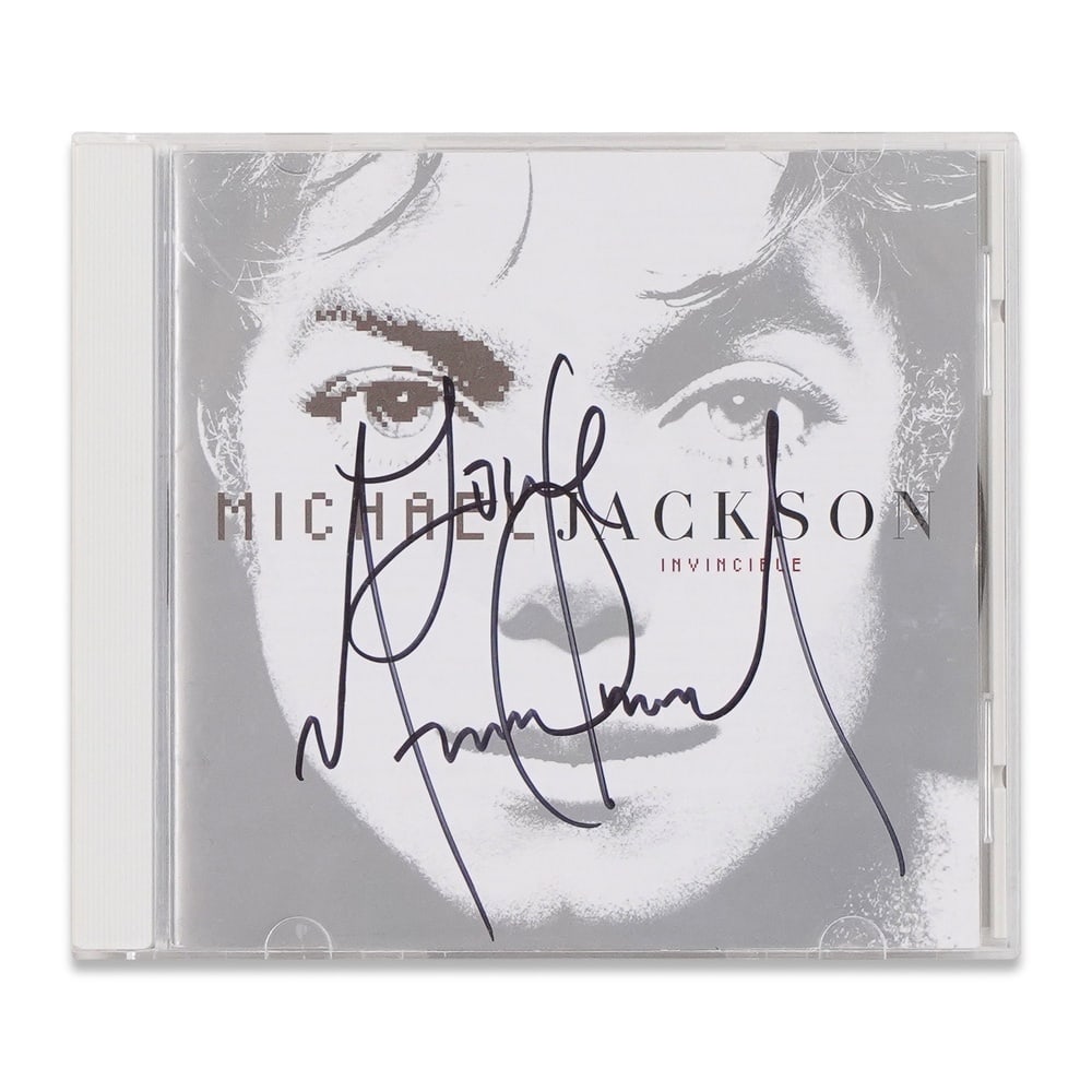 MICHAEL JACKSON SIGNED "INVINCIBLE" CD: 5 5/8 x 4 7/8 in (14.2 x 12.5 cm) Provenance and Authentication: According to the Letter of Authenticity (LOA) and Certificate of Authenticity (COA) provided by the consignor, this collectible was