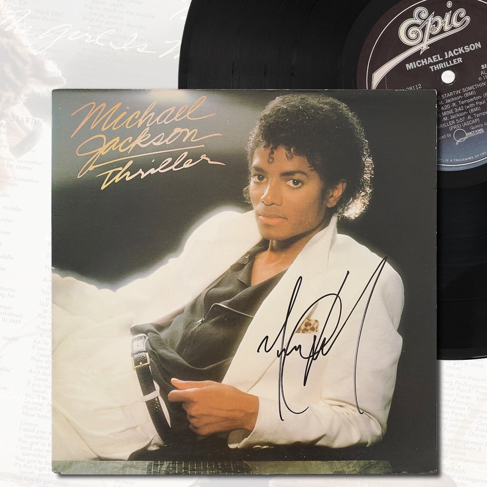 MICHAEL JACKSON SIGNED "THRILLER" LP: 12 3/8 x 12 3/8 in (31.5 x 31.5 cm) Provenance and Authentication: According to the Letter of Authenticity (LOA) and Certificate of Authenticity (COA) provided by the consignor, this collectible was