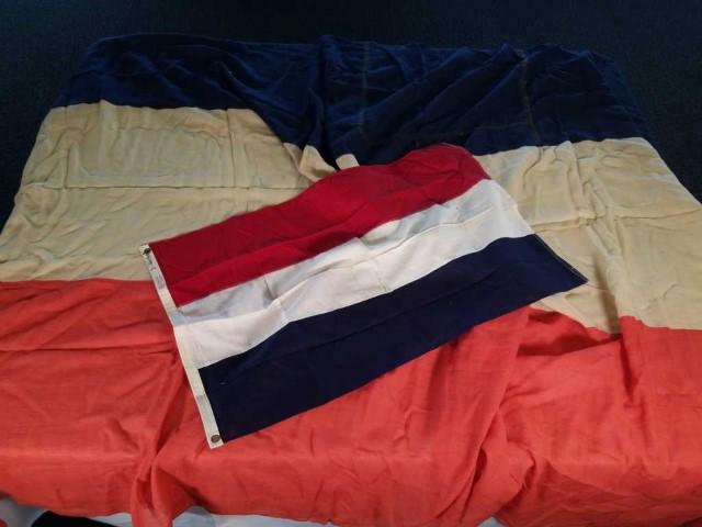 Netherlands Flags, sizes of flags are 6'6" x: 12'8" and 2' x 3'2", large flag has some damage and repair.