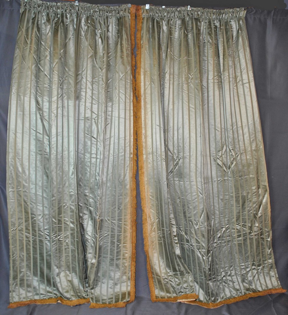 VINTAGE PAIR STRIPED SATIN CURTAIN PANELS DRAPES, 1920s: VINTAGE PAIR STRIPED SATIN CURTAIN PANELS DRAPES, 1920s Vintage set of 2 matching drapery panels, olive in color, with vertical ribbed stripes dating from the 1920s. Gold fringe on one side of each pa