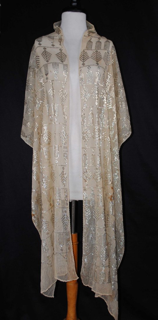 SILVER ASSUIT SHAWL 1920: ART DECO EGYPTIAN ASSUIT SHAWL SILVER FOIL ON NET, 1920 An amazing antique Art Deco Egyptian Assuit shawl scarf, cream colored silver foil on net. It is made of an off white cream color sheer cotton n
