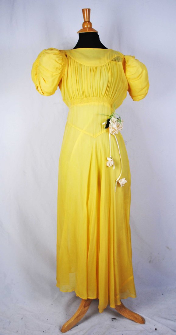 VINTAGE SHEER YELLOW SILK CHIFFON DAY DRESS, LATE c1930s: VINTAGE SHEER YELLOW SILK CHIFFON DAY DRESS, LATE c1930s This late 1930s day dress constructed with a yellow sheer silk chiffon, with V shaped construction on front and back, defining the waist and th