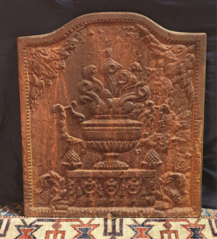 Cast Iron Fireback Featuring a Bold Urn With Flowers: With Flowers 23" W x 26" H x 0.75" D Condition: Good