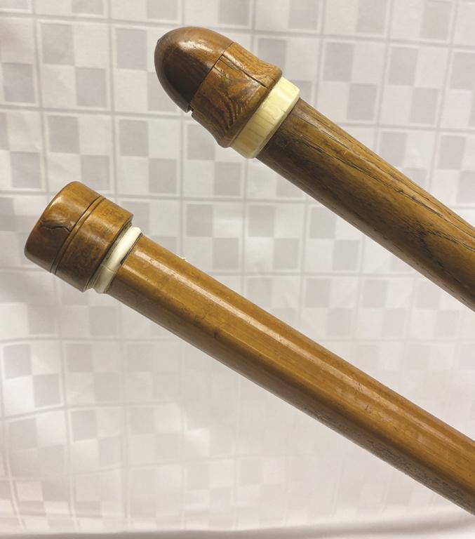 Two Striaght Malacca Shaft Canes: One with a Screw Off: One with a Screw Off Top to Reveal Two Hidden Compartments and One Dome Topped Concealing a Nutmeg Grater Condition: Good except nutmeg cap with breaks