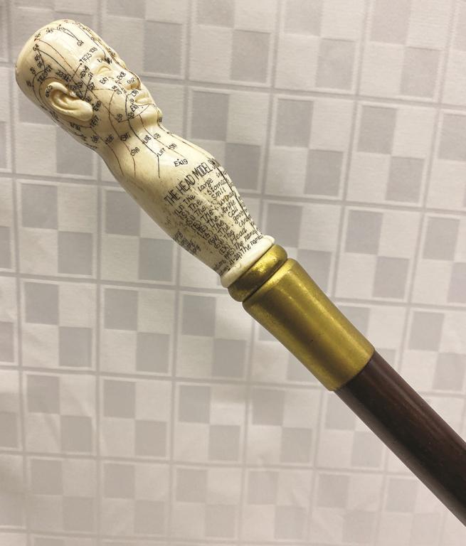 Accupuncturist Cane with a Scrimshaw Head Marked and: and Plotted with Medical Diagram on a Malacca Shaft with Brass Band Condition: Age cracks to face area