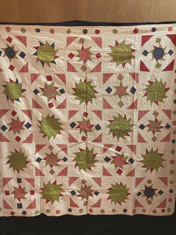 A Piece Quilt made of Lime Sunbursts framed with Red (1 of 1)