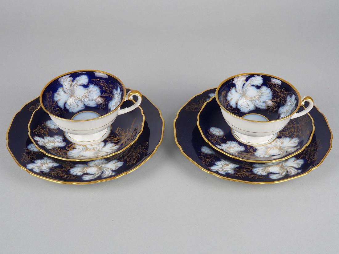 Coffee set Hutschenreuther, twice: Coffee set Hutschenreuther, twiceMade of white porcelain and cobalt blue surface painted with peonies and decorated with gold. Consisting of two cake plates. Ã˜ 19cm, and two cups with saucers. Inta