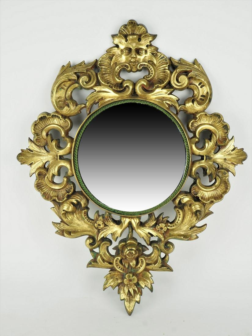 Bronze mirror, neo-baroque around 1880: Bronze mirror, neo-baroque around 1880heavy bronze mirror with rocailles and flowers in relief. Center round cutout for the mirror glass. Oxidized and old patina, used condition with signs of age. H. 