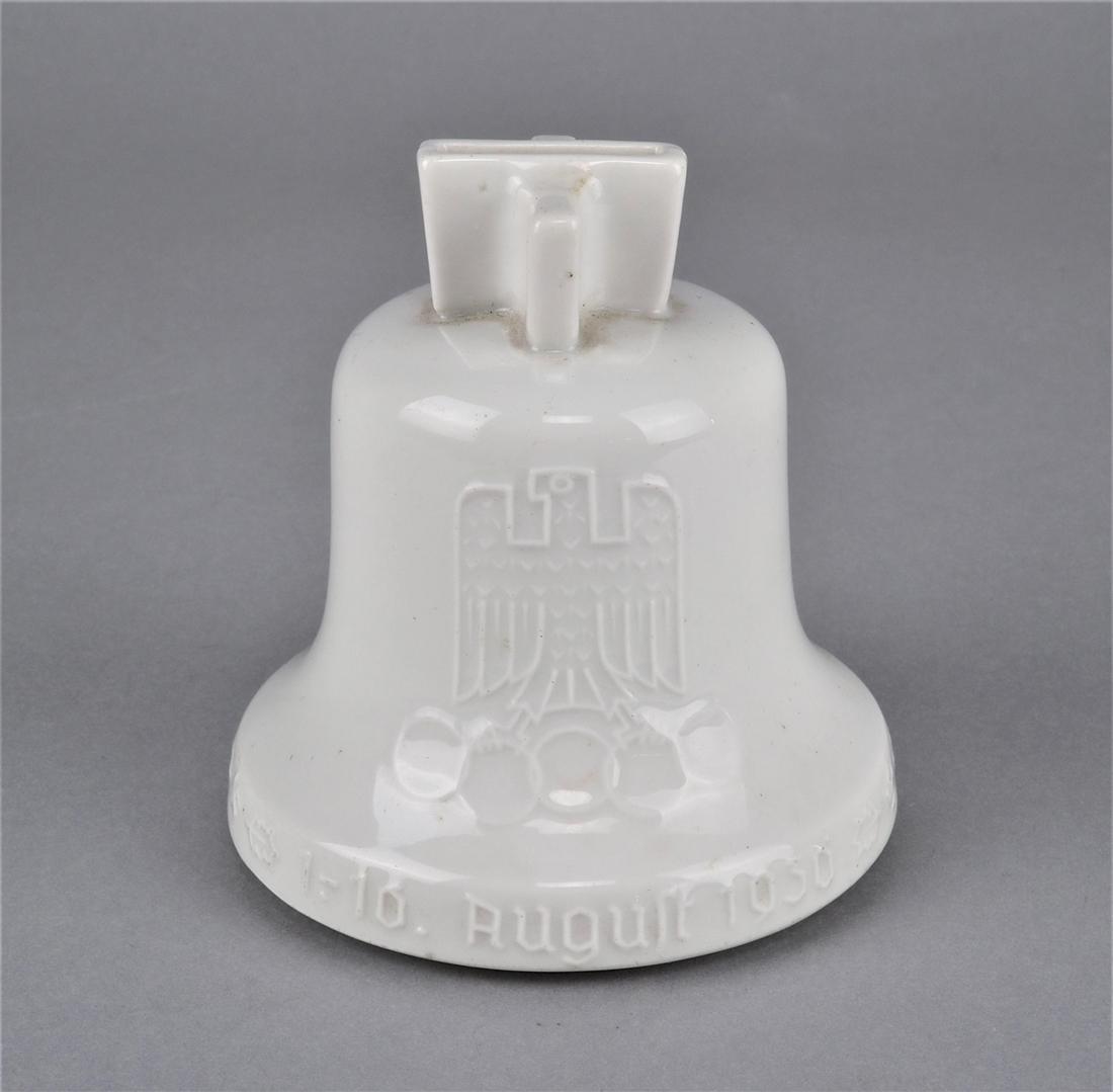 Money box Olympia 1936, German Reich: Money box Olympia 1936, German Reichmade of porcelain, white glazed, in the shape of a bell. Imperial eagle with Olympic rings, Brandenburg Gate and circulating inscription "11th Olympic Games Berlin"
