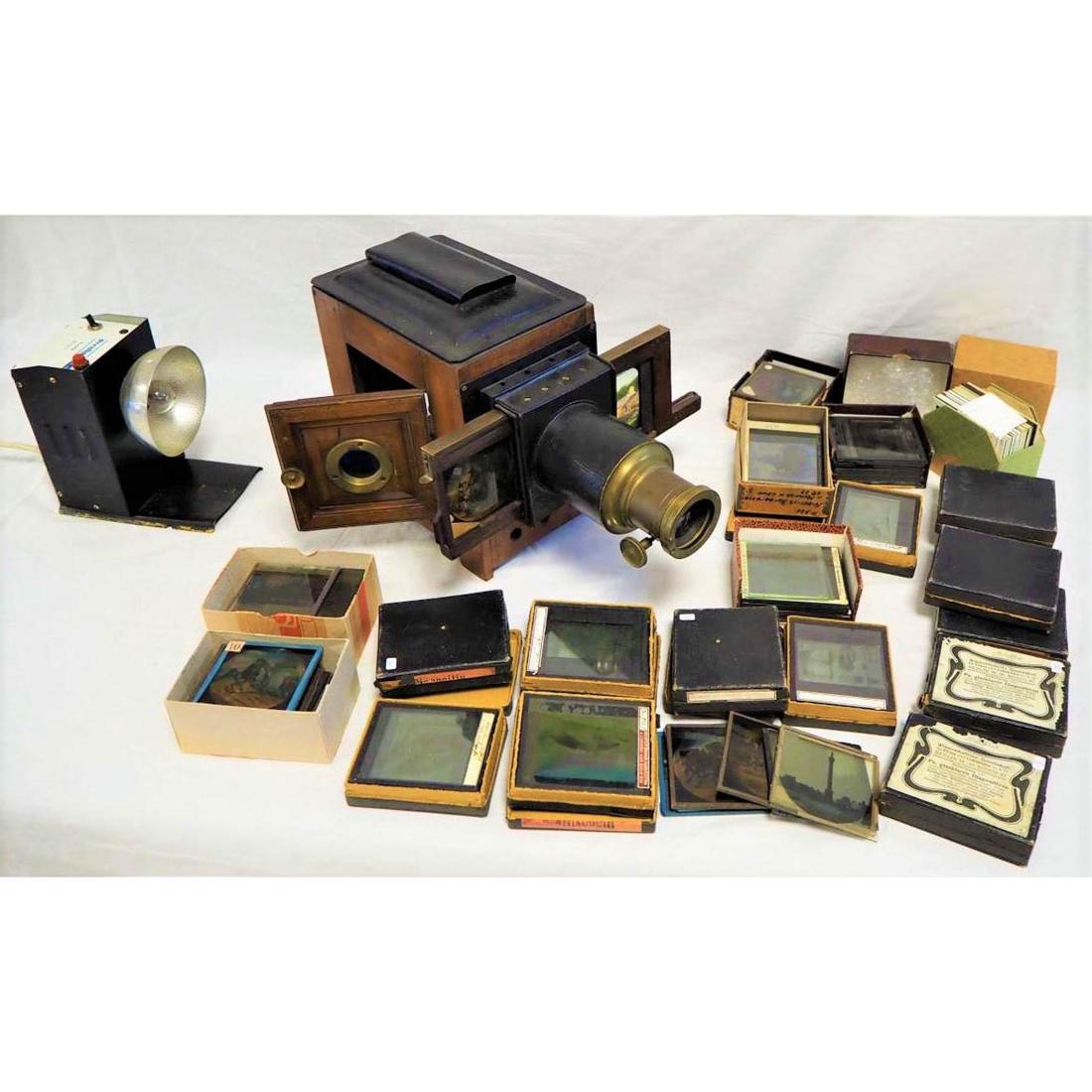 Laterna Magica "Skioptikon" around 1890, with many: Laterna Magica "Skioptikon" around 1890, with many picturesLarge projector, probably german, around 1890, wooden housing with sheet metal and brass attachments, inside with original kerosene burner, a