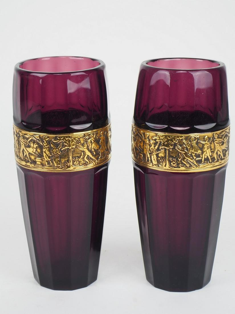 Pair of vases "Walther: Pair of vases "Waltherviolet colored glass, centered with gold colored personaffage. Slightly bulbous shape with rounded mouth. The base is cut flat with a hollow. Marked by maker's logo "Walther" in 