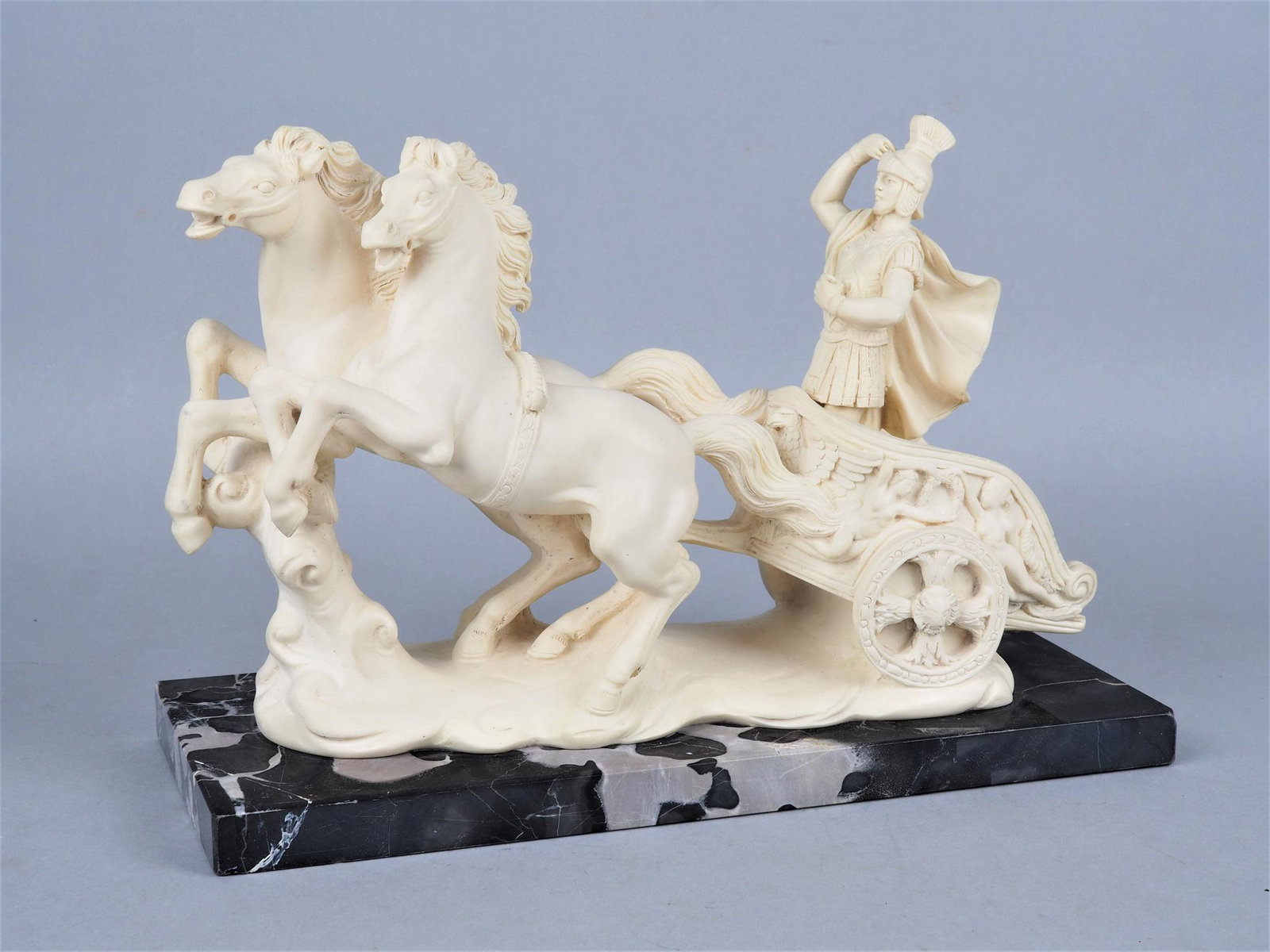 Gino Ruggeri - Roman chariot: Gino Ruggeri - Roman chariot Probably mass, mounted on marble base. Depiction of a Roman in a chariot with two horses. Reins missing. Signed "G. Ruggeri". 20th c. L. 28cm, h. 19cm. Gino Ruggeri - R