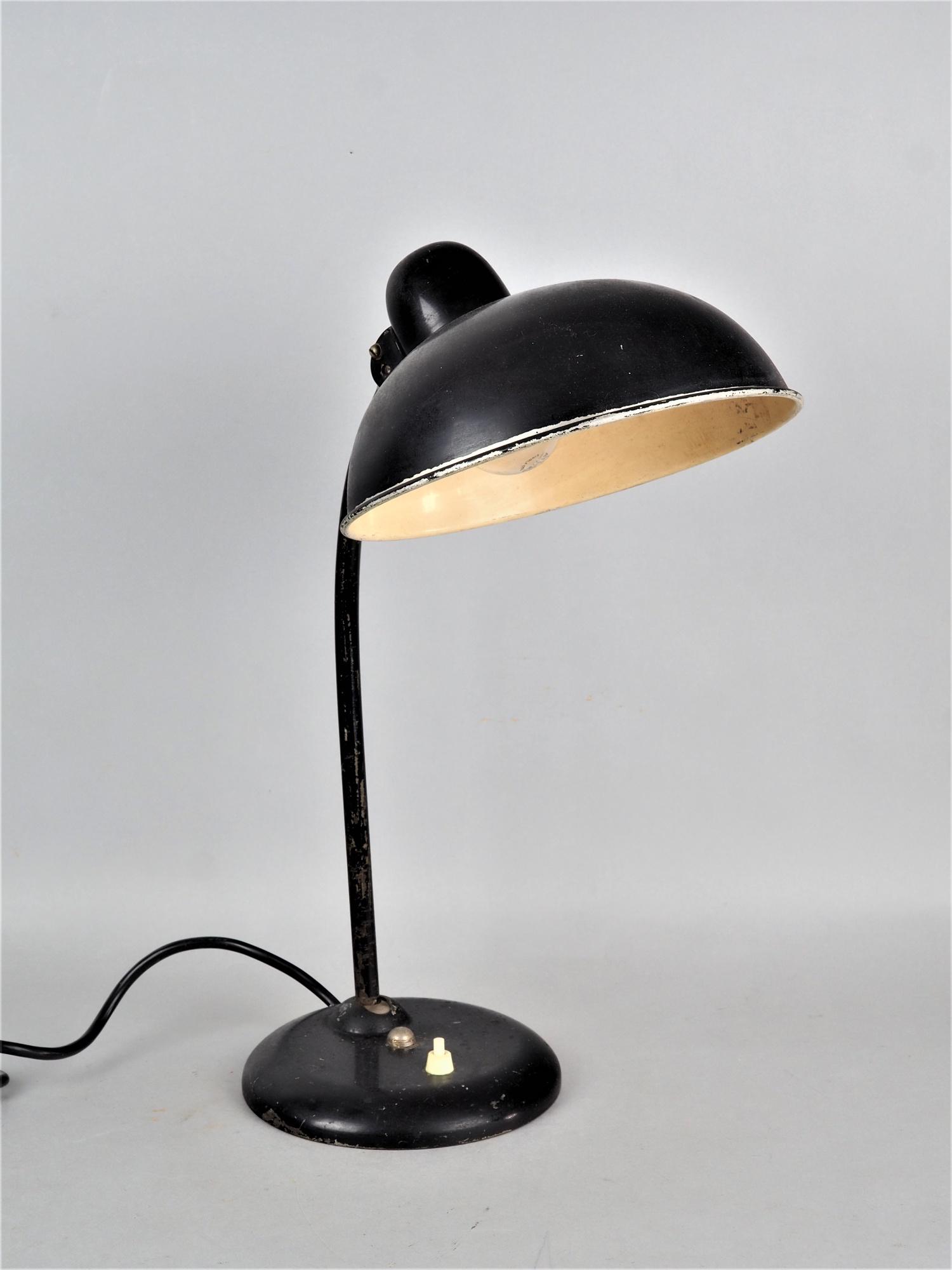 Table lamp 30s: Table lamp 30s In the style of Kaiser idell, blackened metal, round weighted stand with integrated knob switch, tubular stem bulged forward, round bowl-shaped shade with integrated socket E27, working