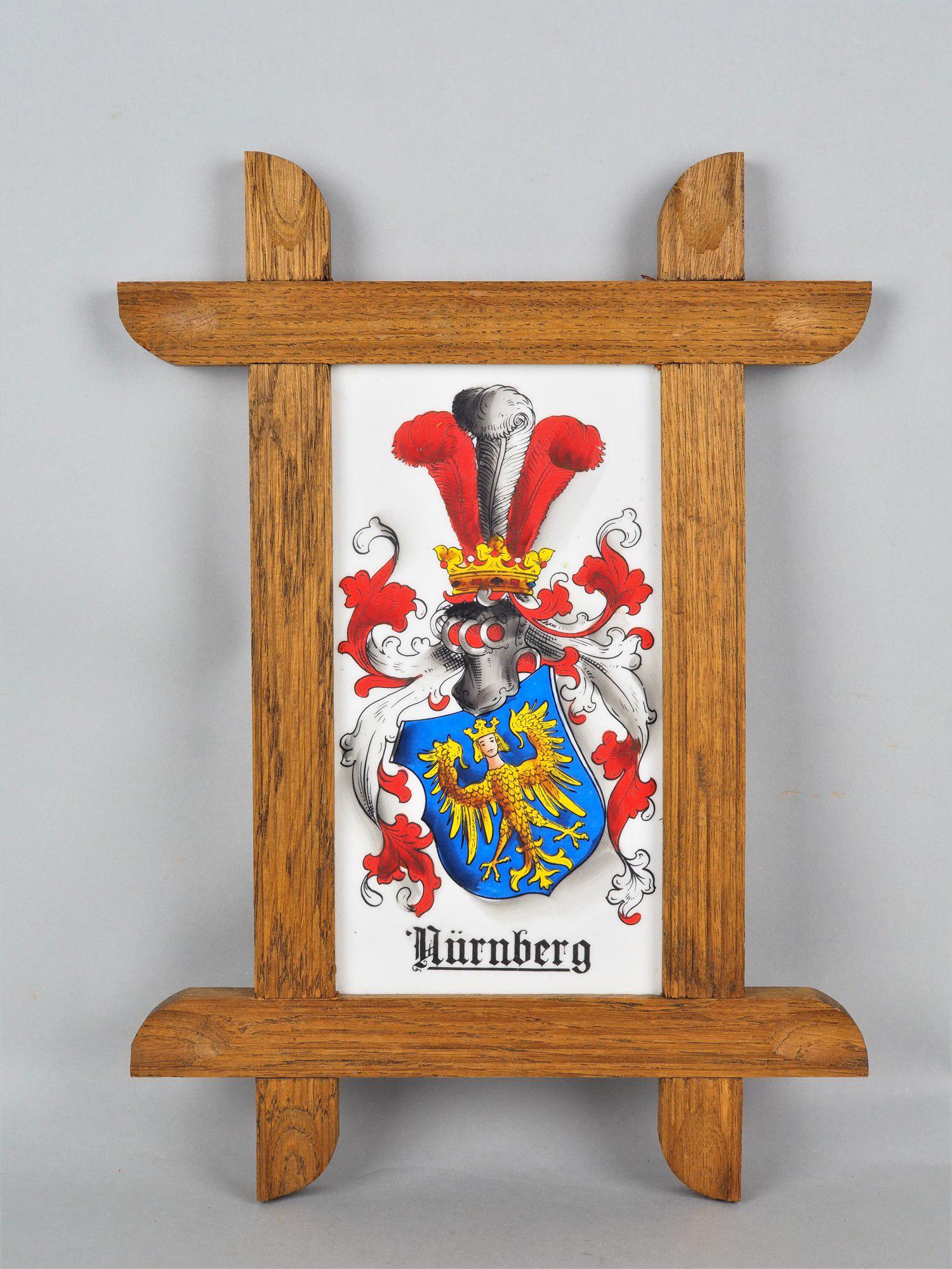 City coat of arms "Nuremberg: City coat of arms "Nuremberg On white porcelain plate, colorfully painted city coat of arms of Nuremberg, in oak frame, intact. H. 39,5cm, w. 28cm Stadtwappen "Nürnberg" Auf weißer Porzellan