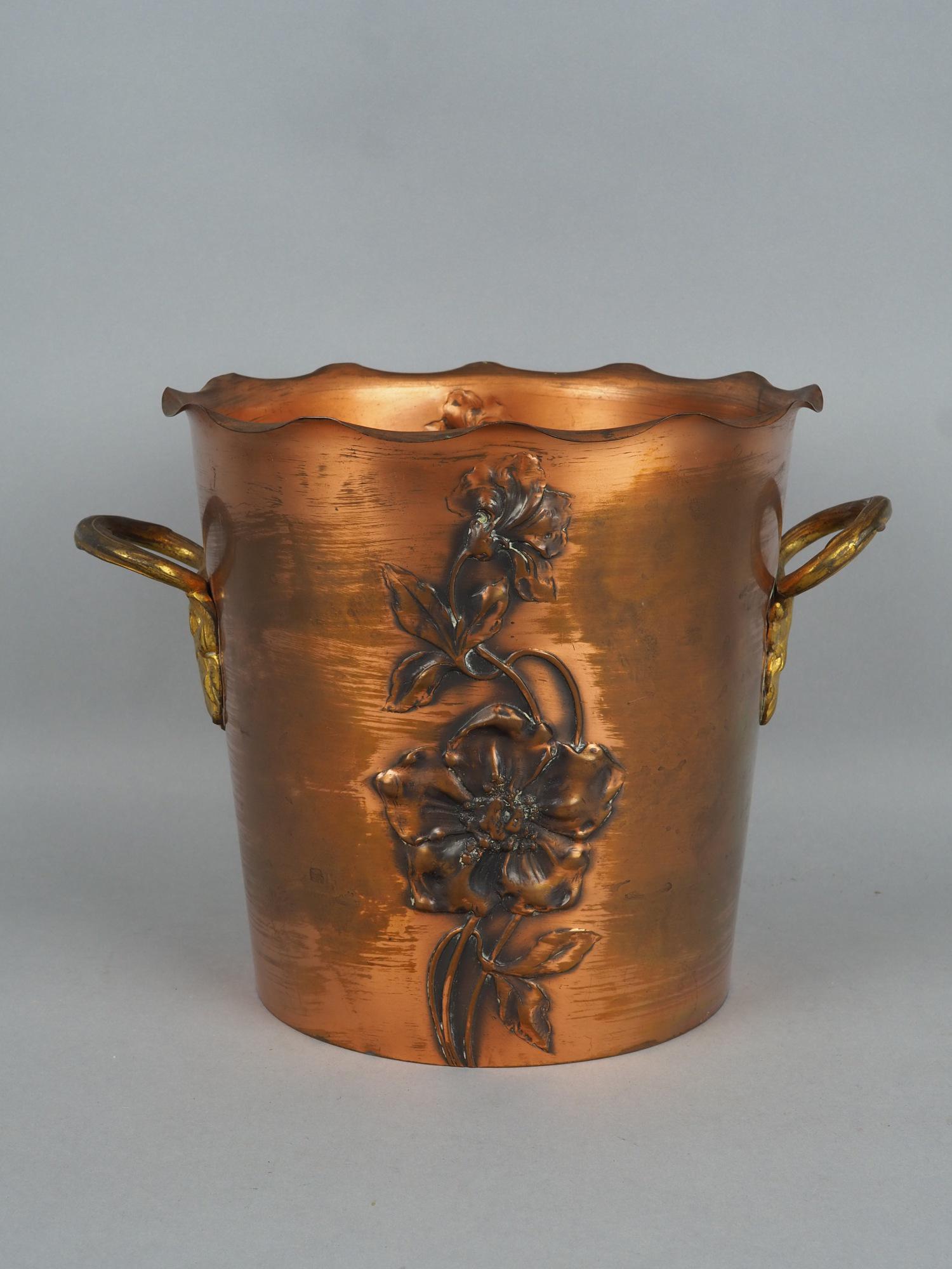 WMF art nouveau champagne cooler around 1910: WMF art nouveau champagne cooler around 1910made of copper, with chased floral pattern. Handles made of brass. On the bottom with WMF ostrich mark and model no. 103. Good condition with traces of use