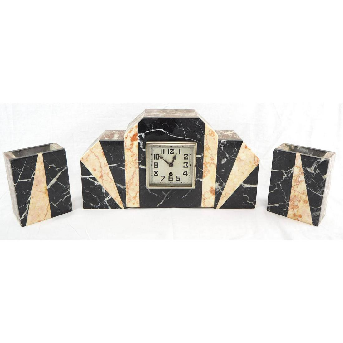 Art Deco Ensemble, around 1920: Art Deco Ensemble, around 1920Consisting of clock with two side tables in multicolored marble. The product is functional. Good, used condition, with slight traces of usage. Around 1920.Clock: H.22cm, 