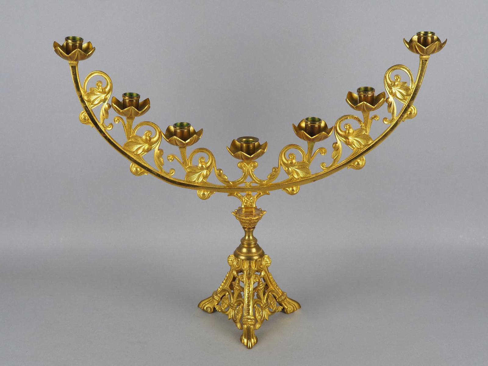 Large "Menorah" candlestick around 1900: Large "Menorah" candlestick around 1900Made of brass and bronze as well as gilded, three-pass broad stand, openwork, tapering to the top, attached candle holder with floral grommets, semicircular, bul
