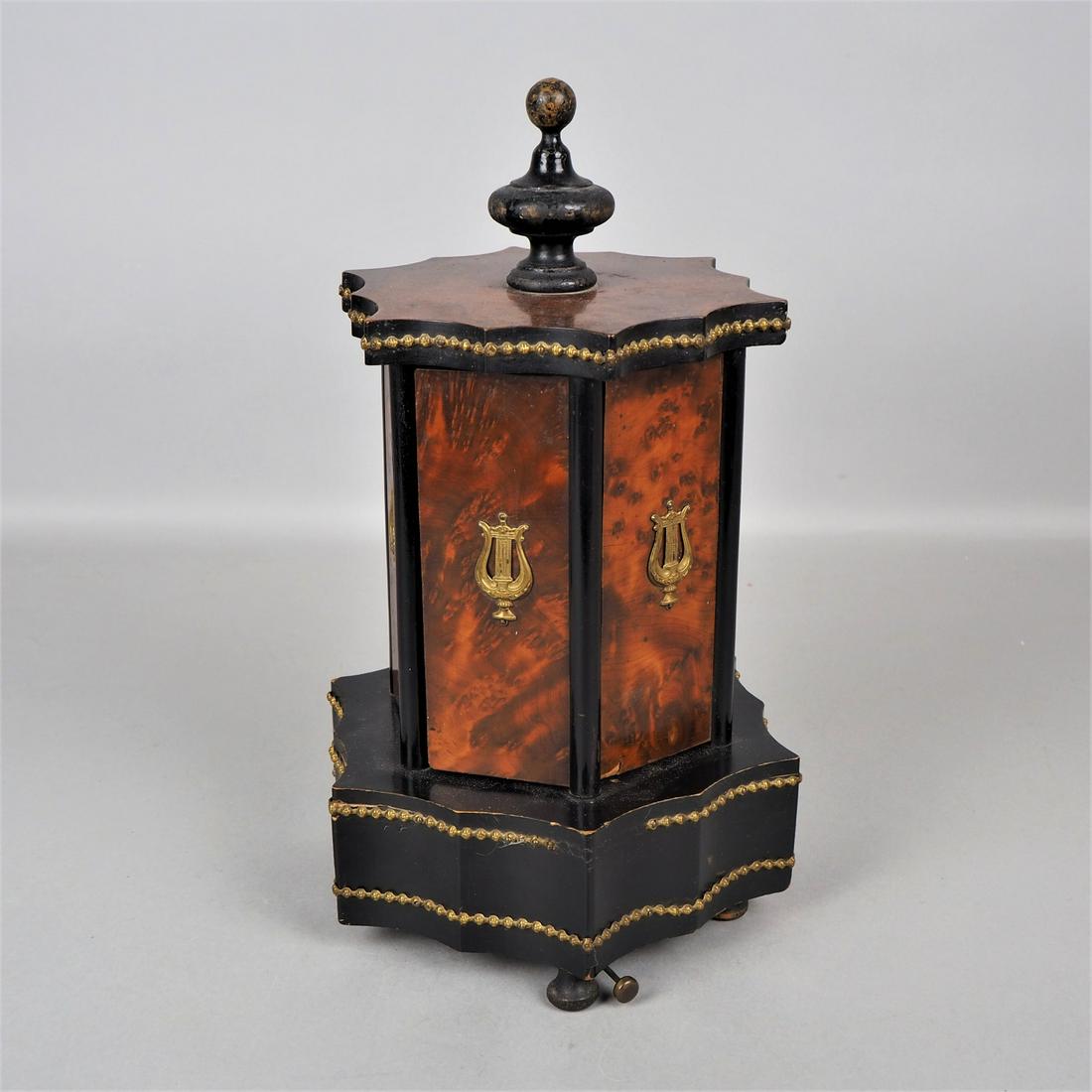 Humidor with musical movement, around 1890: Humidor with musical movement, around 1890so-called cigar carousel. Wide bulbous base with built-in musical mechanism, standing on small feet, on it superstructure with six pivoting doors. Inside with